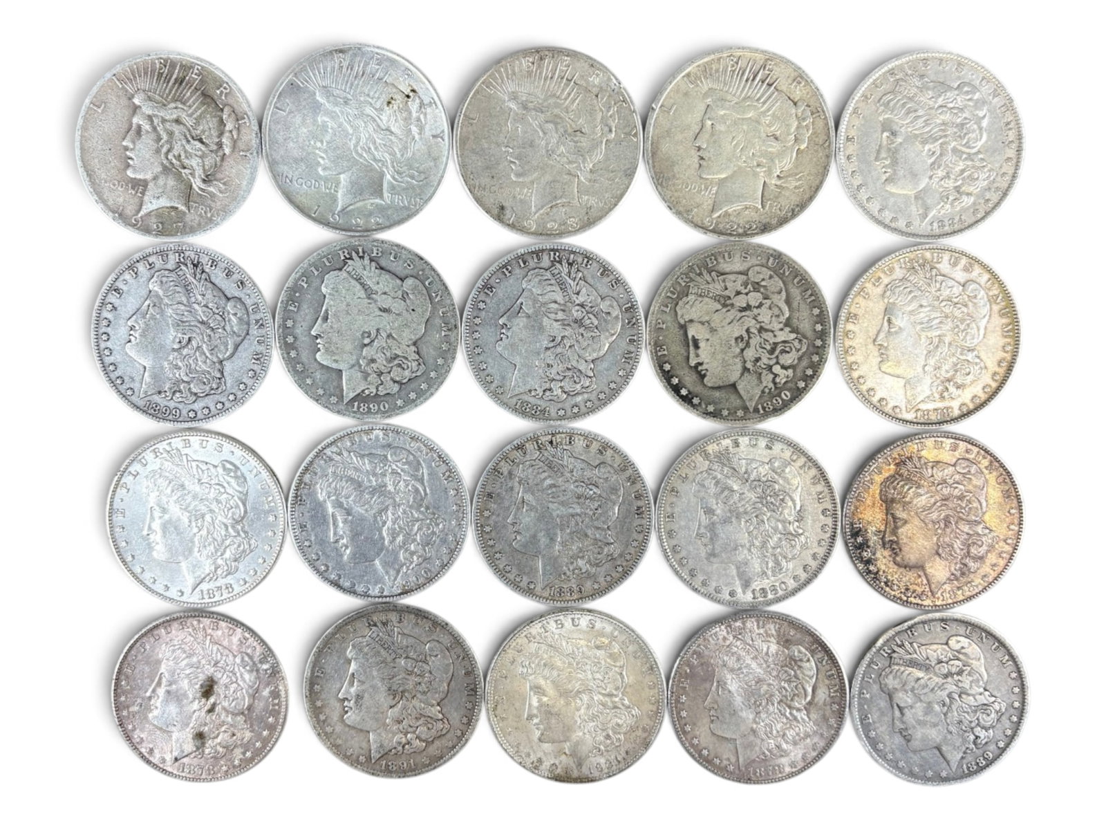 (20) Morgan & Peace Dollars: 20 Morgan Dollar and Peace Dollar coins. Mixed dates and conditions. Shipping: Weiss Auctions offers full-service, in-house shipping for nearly all items in this auction. For a shipping quote, please