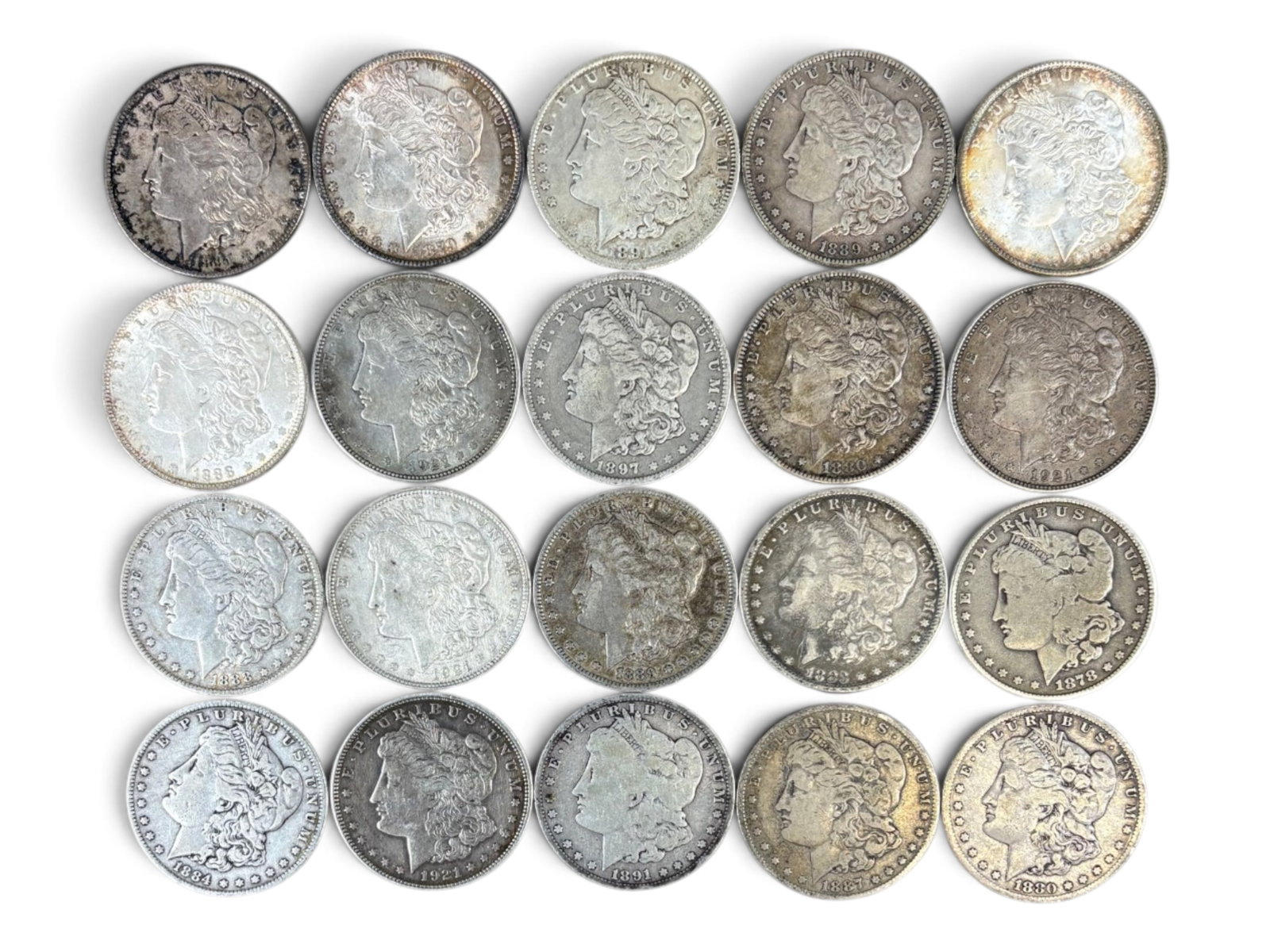 (20) Morgan Dollars: 20 Morgan silver dollars with mixed dates and conditions. Shipping: Weiss Auctions offers full-service, in-house shipping for nearly all items in this auction. For a shipping quote, please contact us 