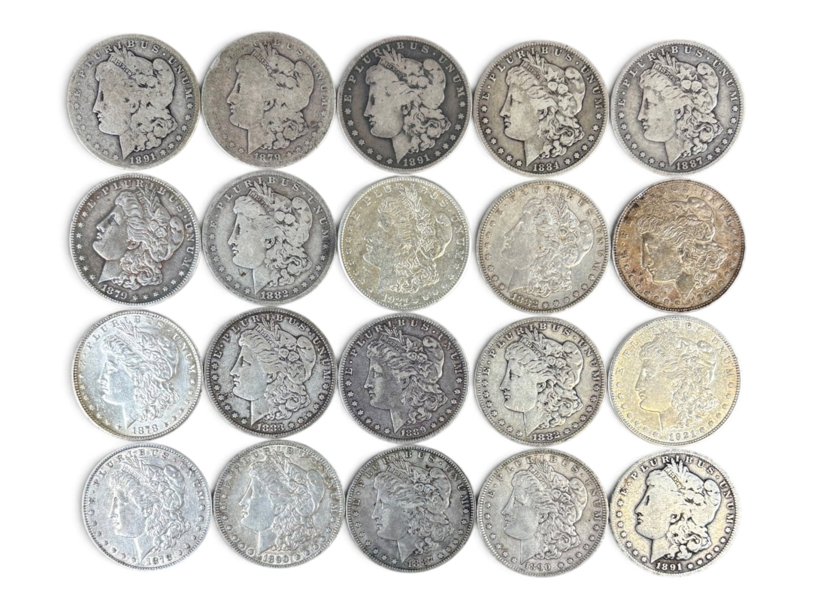 (20) Morgan Dollars: 20 Morgan silver dollars with mixed dates and conditions. Shipping: Weiss Auctions offers full-service, in-house shipping for nearly all items in this auction. For a shipping quote, please contact us