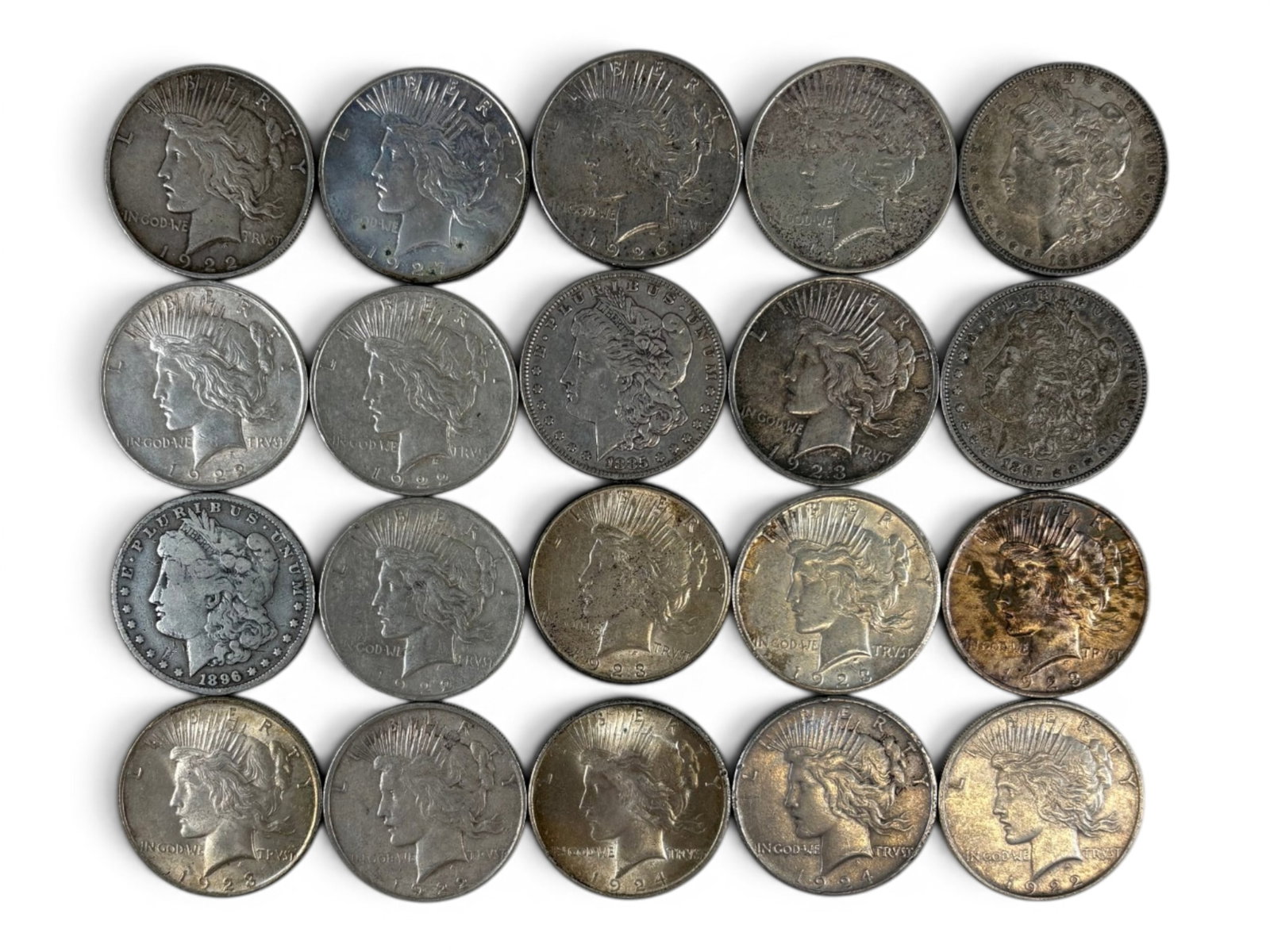 (20) Morgan & Peace Dollars: 20 Morgan and Peace silver dollars with mixed dates and conditions. Shipping: Weiss Auctions offers full-service, in-house shipping for nearly all items in this auction. For a shipping quote, please