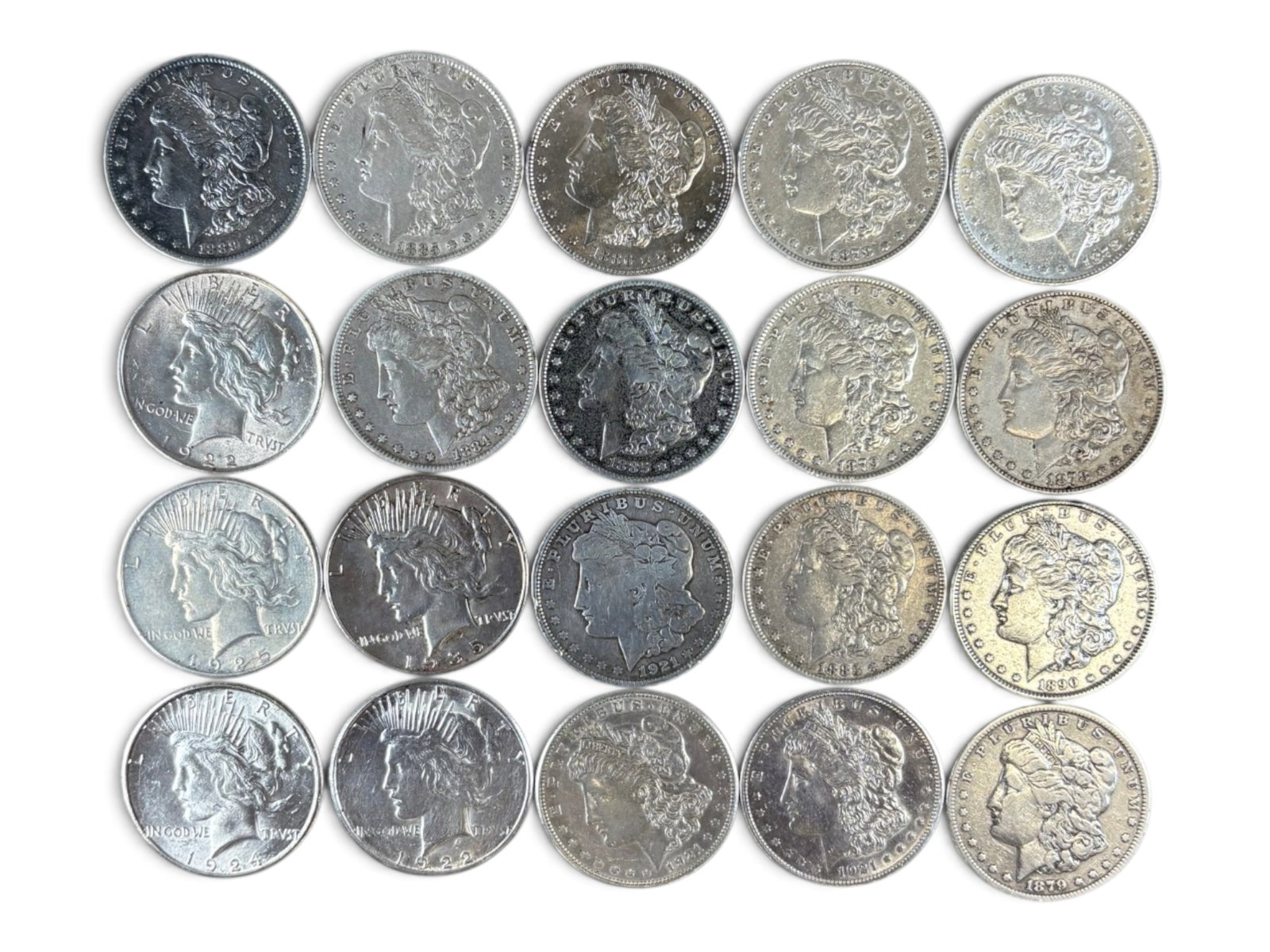 (20) Morgan & Peace Dollars: 20 Morgan and Peace silver dollars with mixed dates and conditions. Shipping: Weiss Auctions offers full-service, in-house shipping for nearly all items in this auction. For a shipping quote, please
