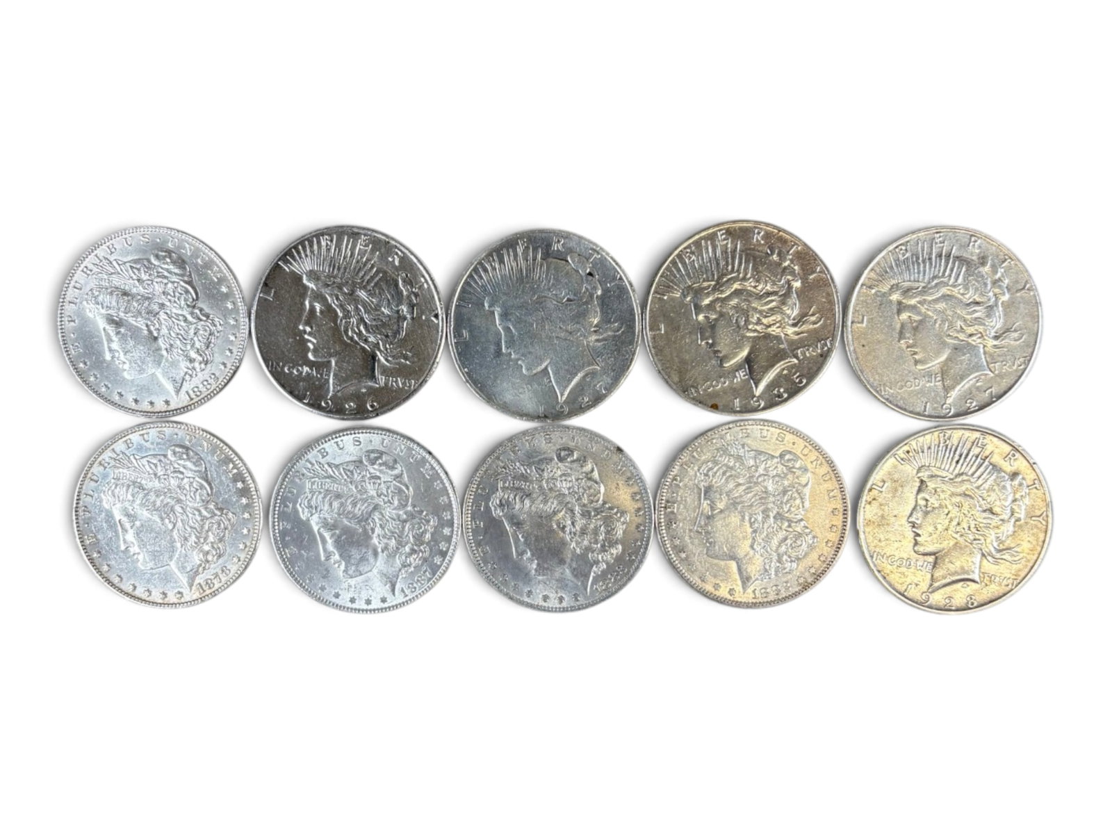 (10) Morgan & Peace Dollars: 10 Morgan and Peace silver dollars with mixed dates and conditions. Shipping: Weiss Auctions offers full-service, in-house shipping for nearly all items in this auction. For a shipping quote, please