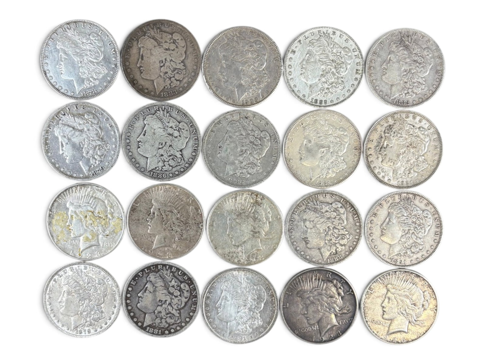 (20) Morgan & Peace Dollars: Group of 20 Morgan and Peace silver dollars with mixed dates and conditions. Shipping: Weiss Auctions offers full-service, in-house shipping for nearly all items in this auction. For a shipping quote,
