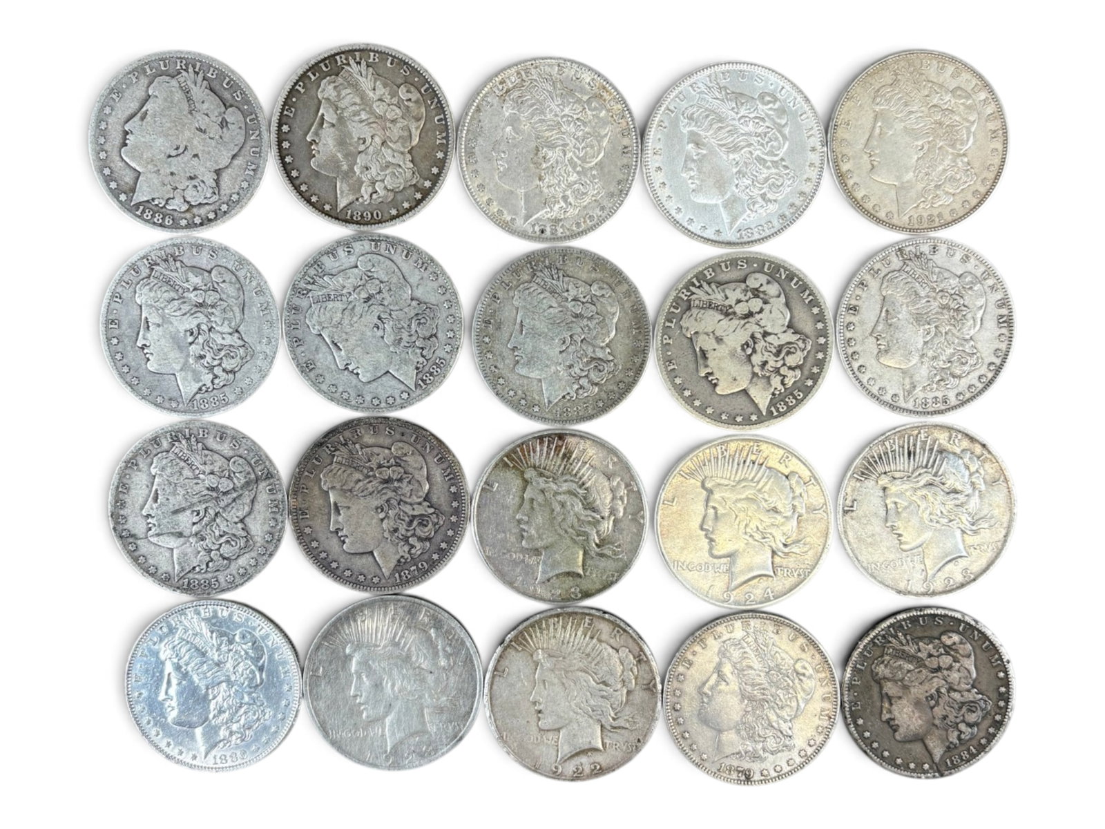 (20) Morgan & Peace Dollars: Group of 20 Morgan and Peace silver dollars with mixed dates and conditions. Shipping: Weiss Auctions offers full-service, in-house shipping for nearly all items in this auction. For a shipping quote,