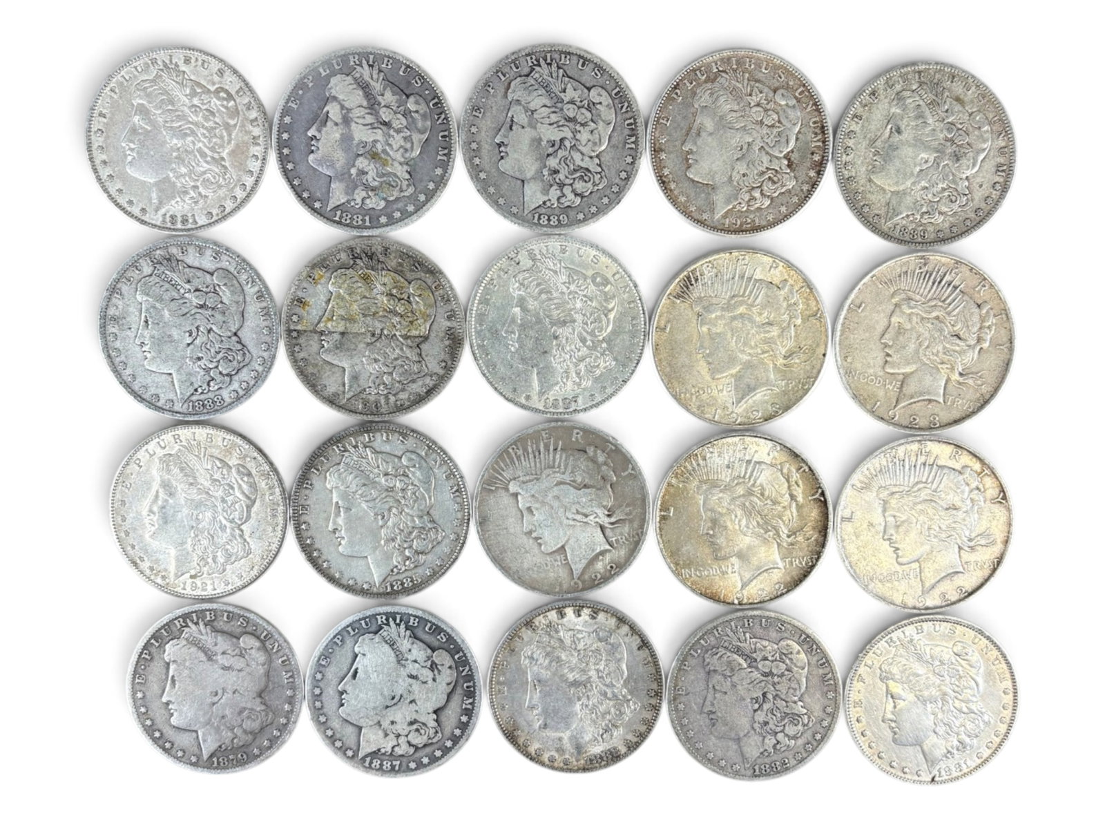 (20) Morgan & Peace Dollars: Group of 20 Morgan and Peace silver dollars with mixed dates and conditions. Shipping: Weiss Auctions offers full-service, in-house shipping for nearly all items in this auction. For a shipping quote,
