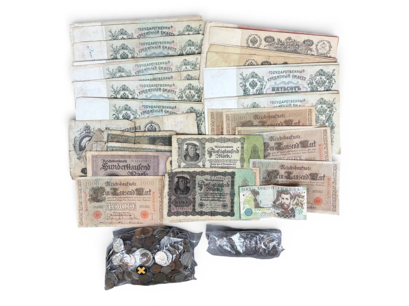 Estate Coin and Currency Collection: Estate coin and currency collection including U.S., foreign, and tokens. Includes 1 ozt silver bar. Some silver coins. Examine.This lot is being offered on behalf of the New York County Public
