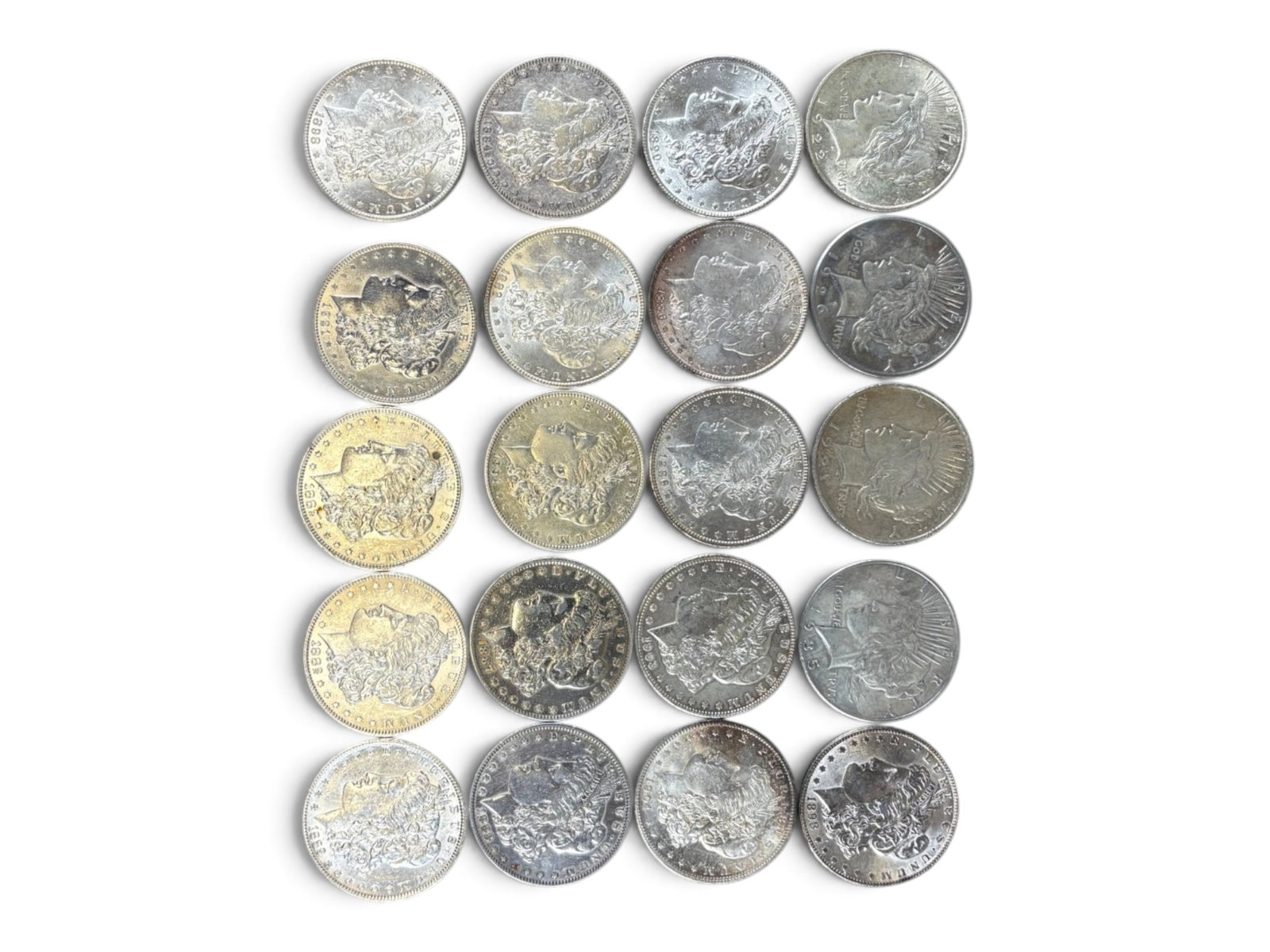(20) Morgan and Peace Dollars: 20 Morgan and Peace Dollars. Mixed dates and grades. See images. Shipping: Weiss Auctions offers full-service, in-house shipping for nearly all items in this auction. For a shipping quote, please cont