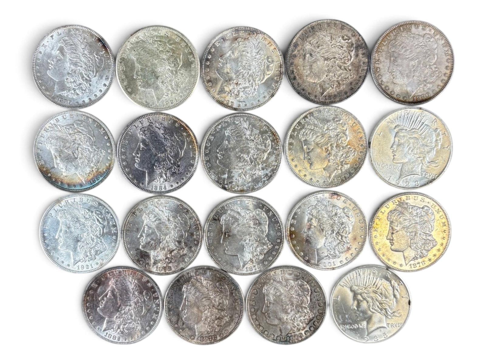 (19) Morgan & Peace Dollars: 19 High Grade Morgan and Peace Dollars. Assorted dates. See images.This lot is being offered on behalf of the Kings County Public Administrators Office from the Estate of Michael Amodeo (PA#201116) DE