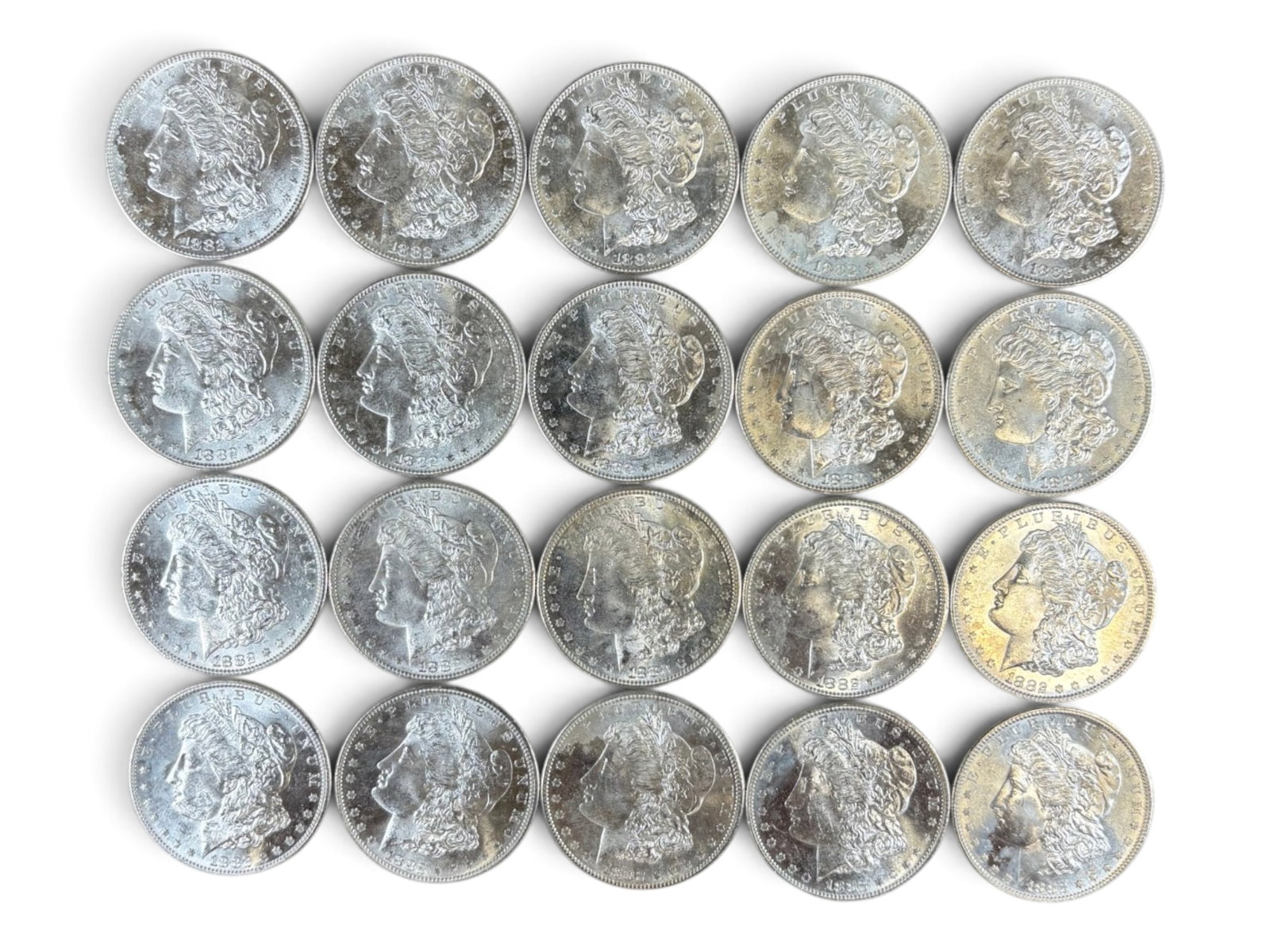 (20) 1882-S Morgan Dollars: 20 High Grade 1882-S Morgan Dollars. See images.This lot is being offered on behalf of the Kings County Public Administrators Office from the Estate of Michael Amodeo (PA#201116) DE8554128. Shipping: 