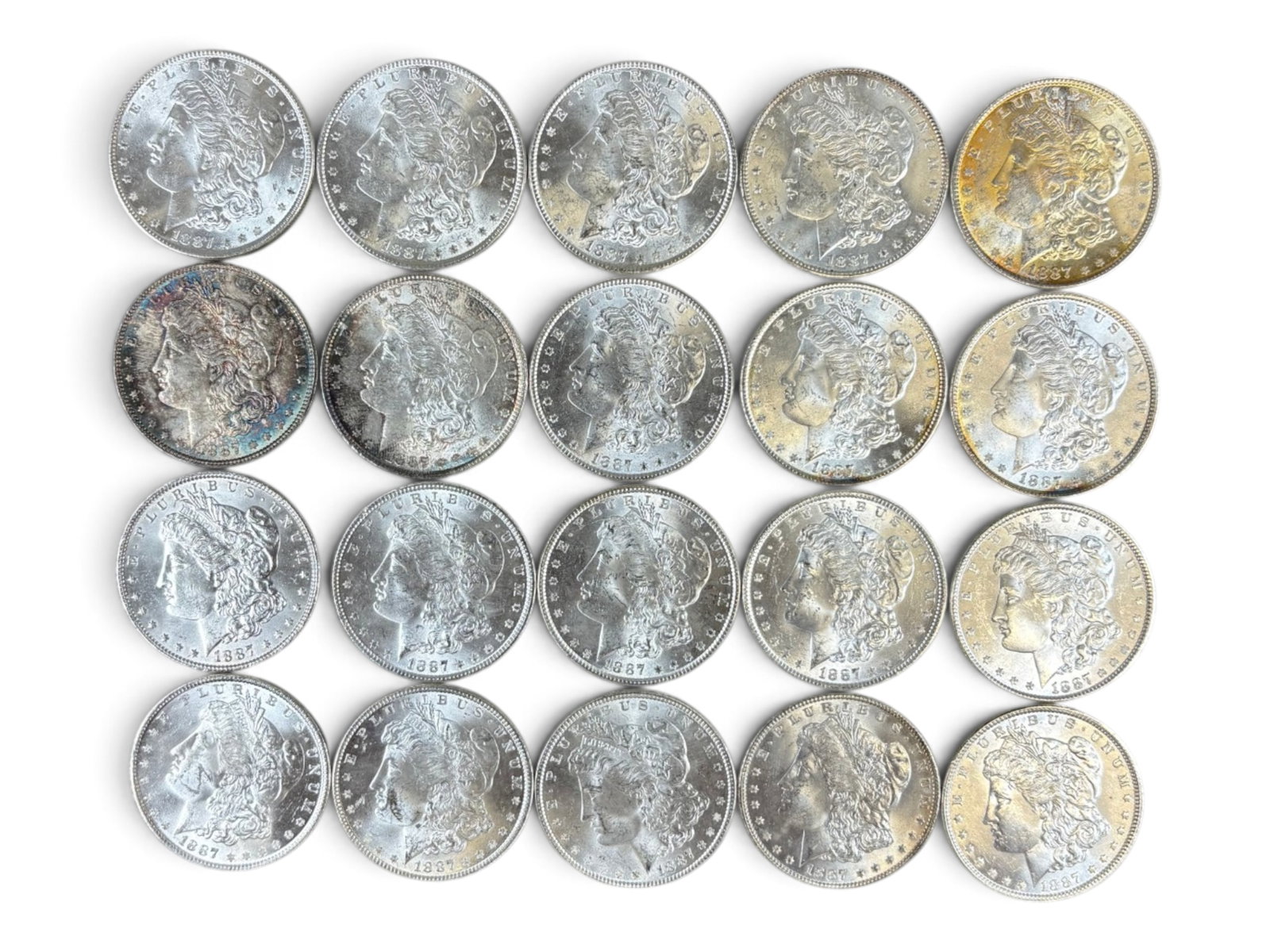 (20) 1887 Morgan Dollars: 20 High Grade 1887 Morgan Dollars. See images.This lot is being offered on behalf of the Kings County Public Administrators Office from the Estate of Michael Amodeo (PA#201116) DE8554128. Shipping:
