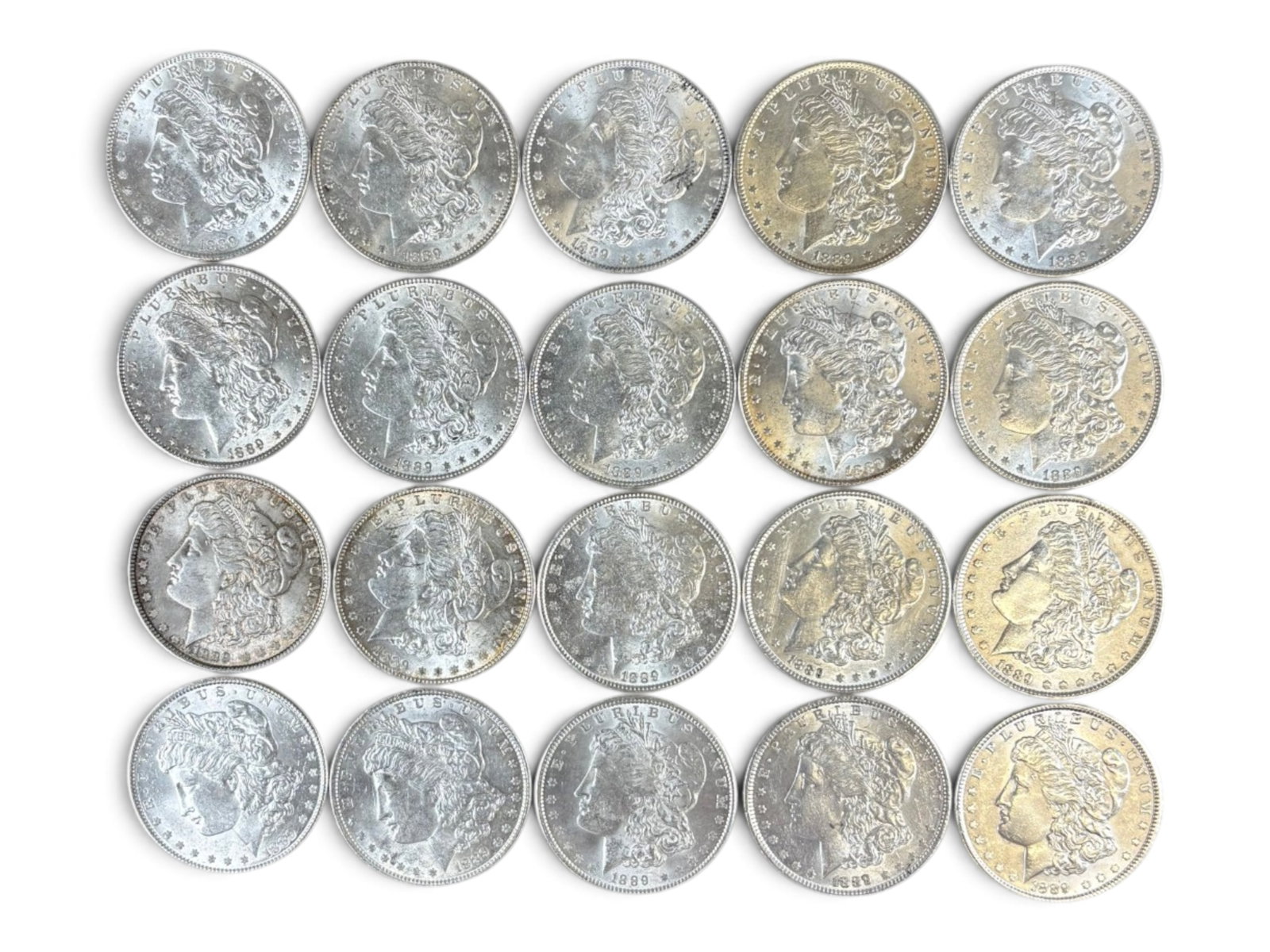 (20) 1889 Morgan Dollars: 20 High Grade 1889 Morgan Dollars. See images.This lot is being offered on behalf of the Kings County Public Administrators Office from the Estate of Michael Amodeo (PA#201116) DE8554128. Shipping: We