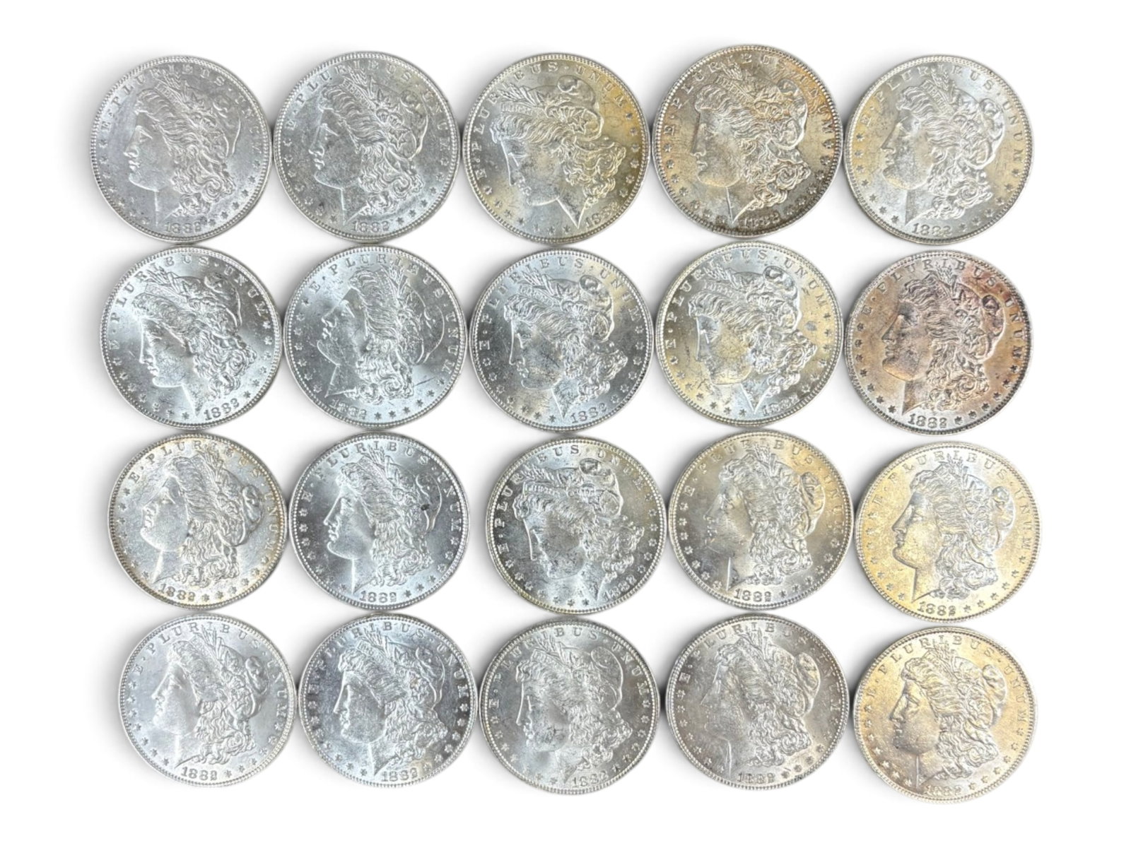 (20) 1882 Morgan Dollars: 20 High Grade 1882 Morgan Dollars. See images.This lot is being offered on behalf of the Kings County Public Administrators Office from the Estate of Michael Amodeo (PA#201116) DE8554128. Shipping: We