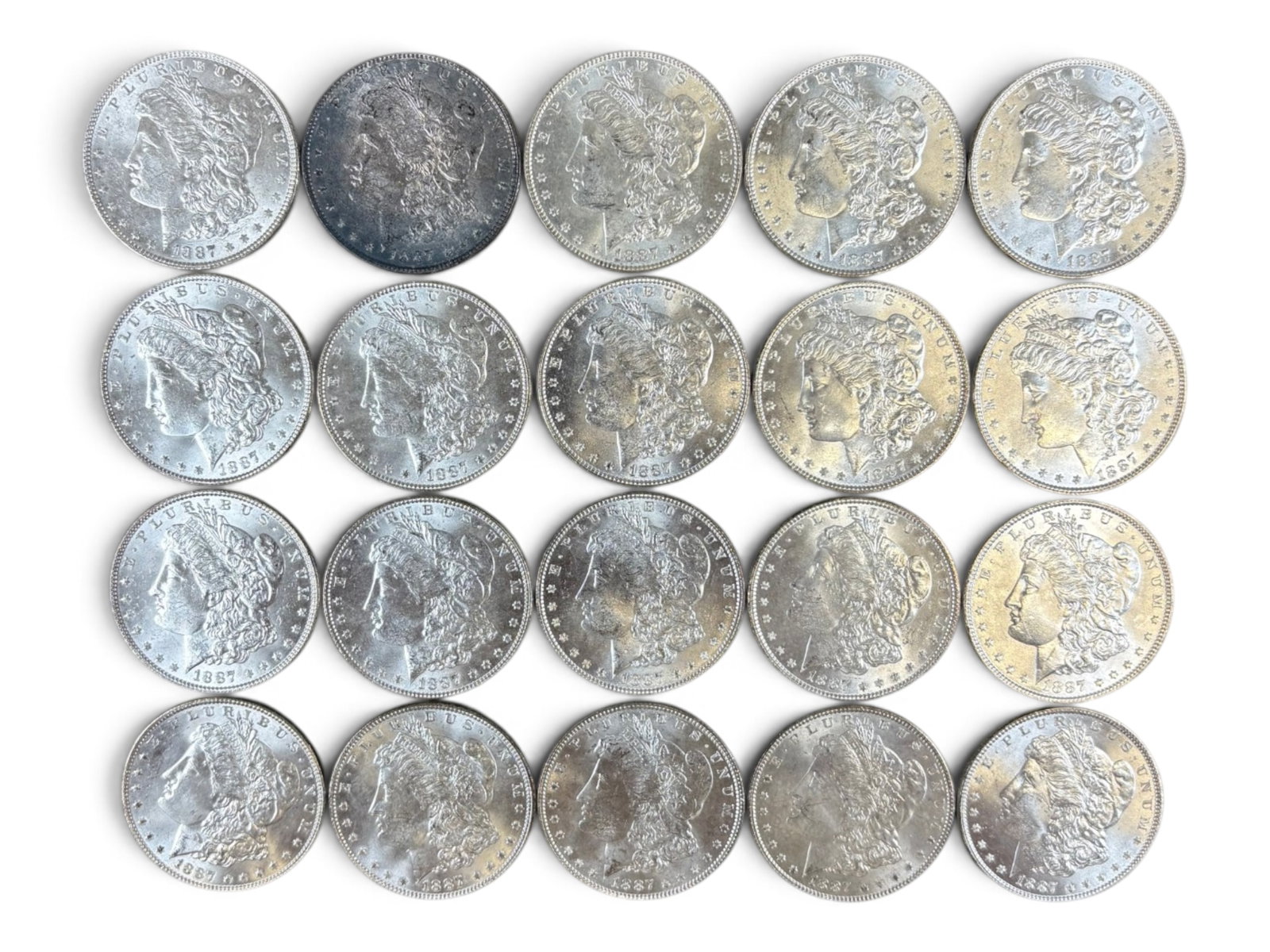 (20) 1887 Morgan Dollars: 20 High Grade 1887 Morgan Dollars. See images.This lot is being offered on behalf of the Kings County Public Administrators Office from the Estate of Michael Amodeo (PA#201116) DE8554128. Shipping: