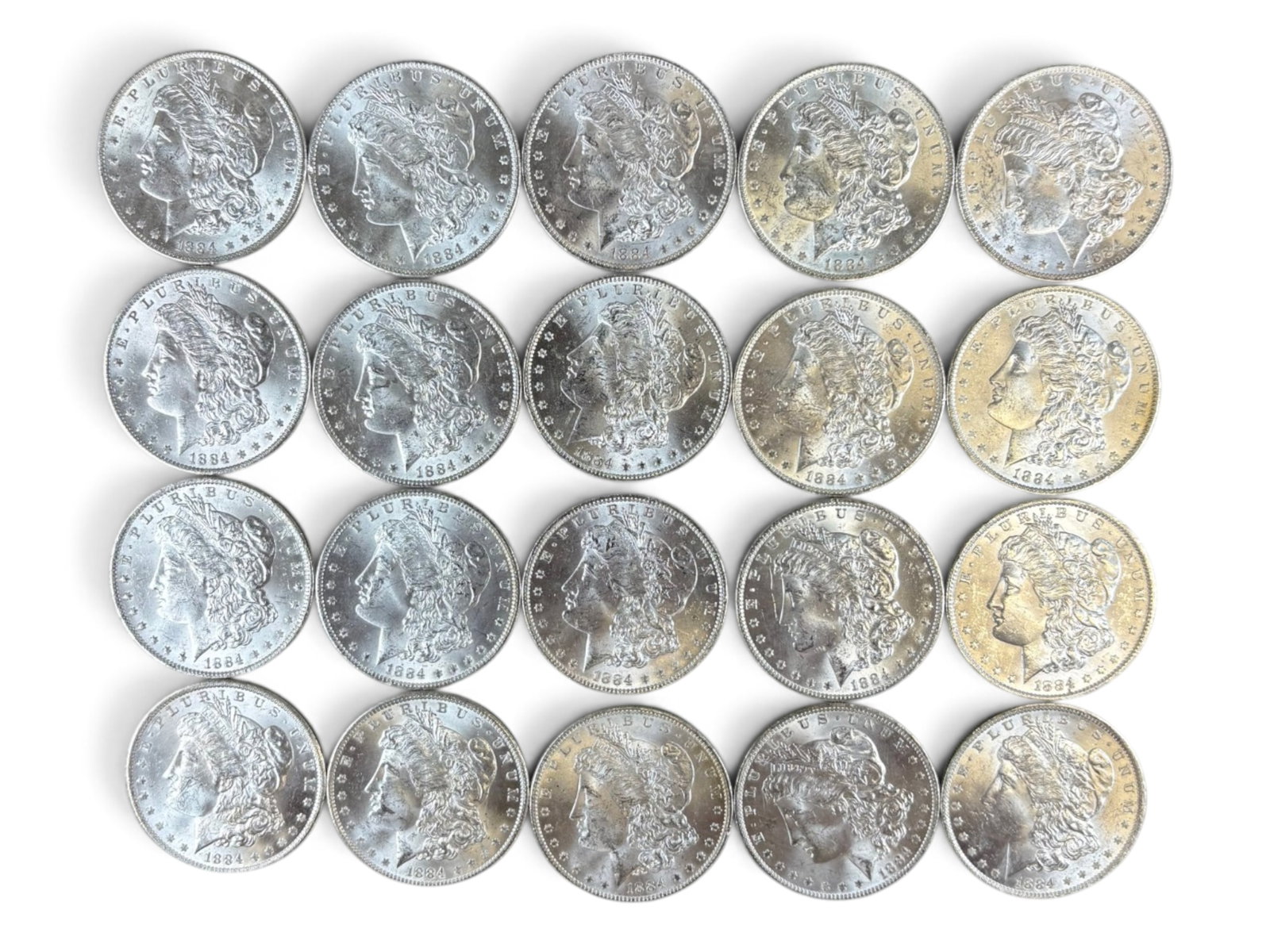 (20) 1884-O Morgan Dollars: 20 High Grade 1884-O Morgan Dollars. See images.This lot is being offered on behalf of the Kings County Public Administrators Office from the Estate of Michael Amodeo (PA#201116) DE8554128. Shipping: