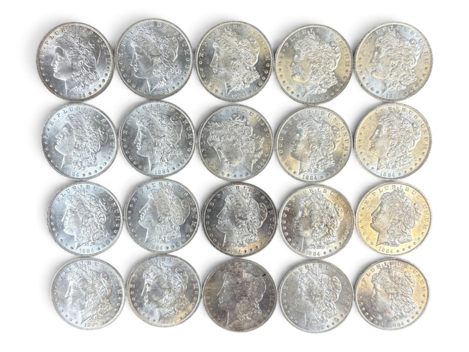 (20) 1884-O Morgan Dollars: 20 High Grade 1884-O Morgan Dollars. See images.This lot is being offered on behalf of the Kings County Public Administrators Office from the Estate of Michael Amodeo (PA#201116) DE8554128. Shipping: