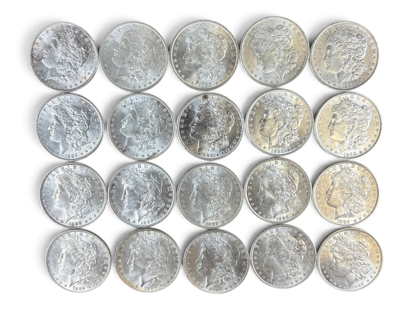 (20) 1889 Morgan Dollars: 20 High Grade 1889 Morgan Dollars. See images.This lot is being offered on behalf of the Kings County Public Administrators Office from the Estate of Michael Amodeo (PA#201116) DE8554128. Shipping: