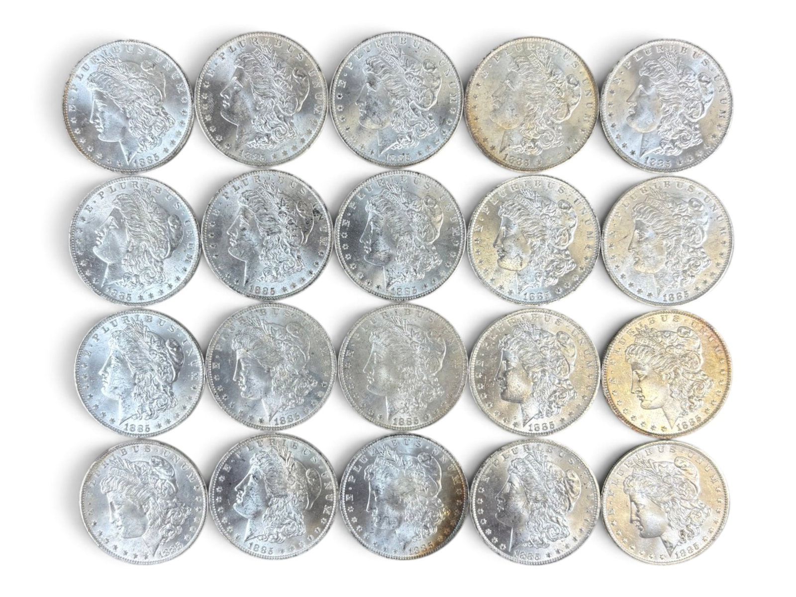 (20) 1885-O Morgan Dollars: 20 High Grade 1885-O Morgan Dollars. See images.This lot is being offered on behalf of the Kings County Public Administrators Office from the Estate of Michael Amodeo (PA#201116) DE8554128. Shipping: 