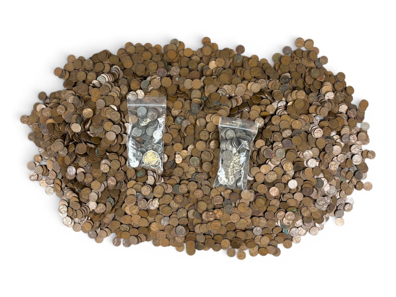 Estate Coin Collection: Estate coin collection including 1 American Silver Eagle, a quantity og Buffalo Nickels, 1 Indian Head Cent, Steel Cents, 1 1964 Half Dollar in Bezel, and 40+ pounds of Lincoln Cents, primarily wheat