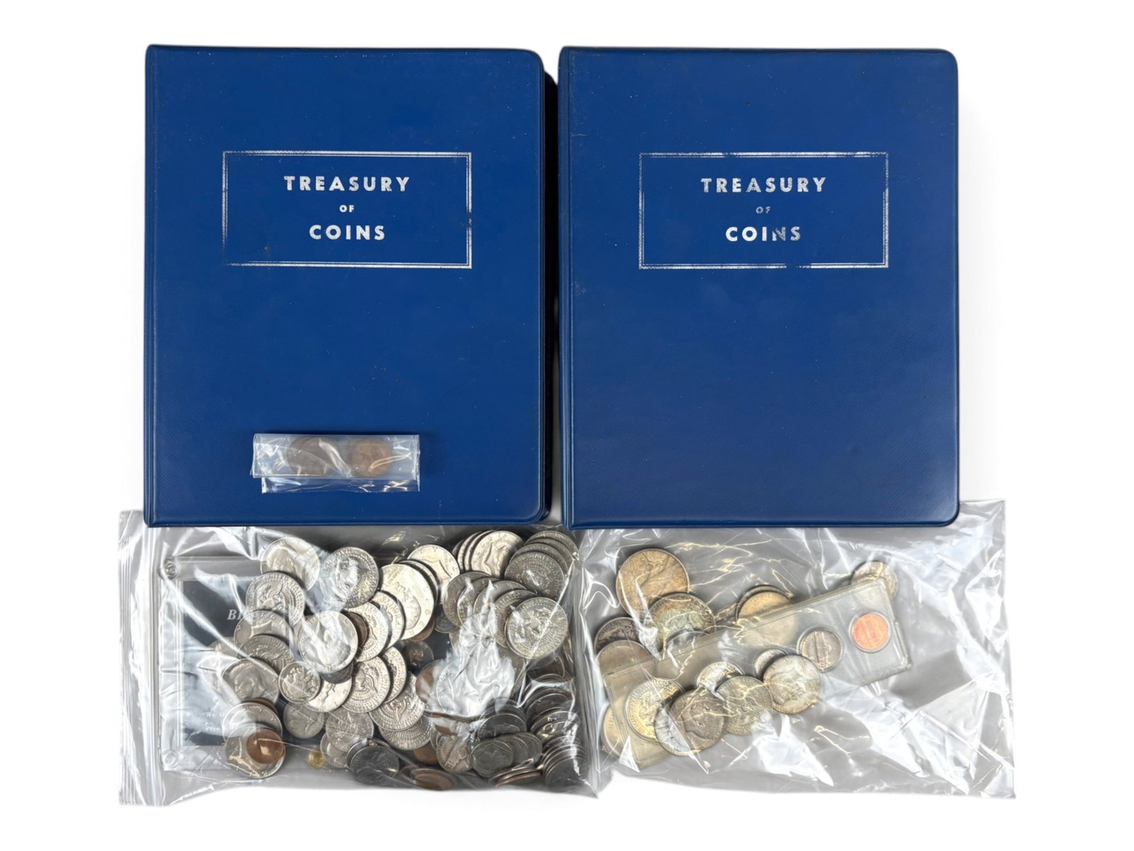 Estate Coin Collection: Estate coin collection including 2 partial Treasury of Coins albums and various U.S. silver and non-silver coins. Examine.This lot is being offered on behalf of the Bronx County Public Administrator f