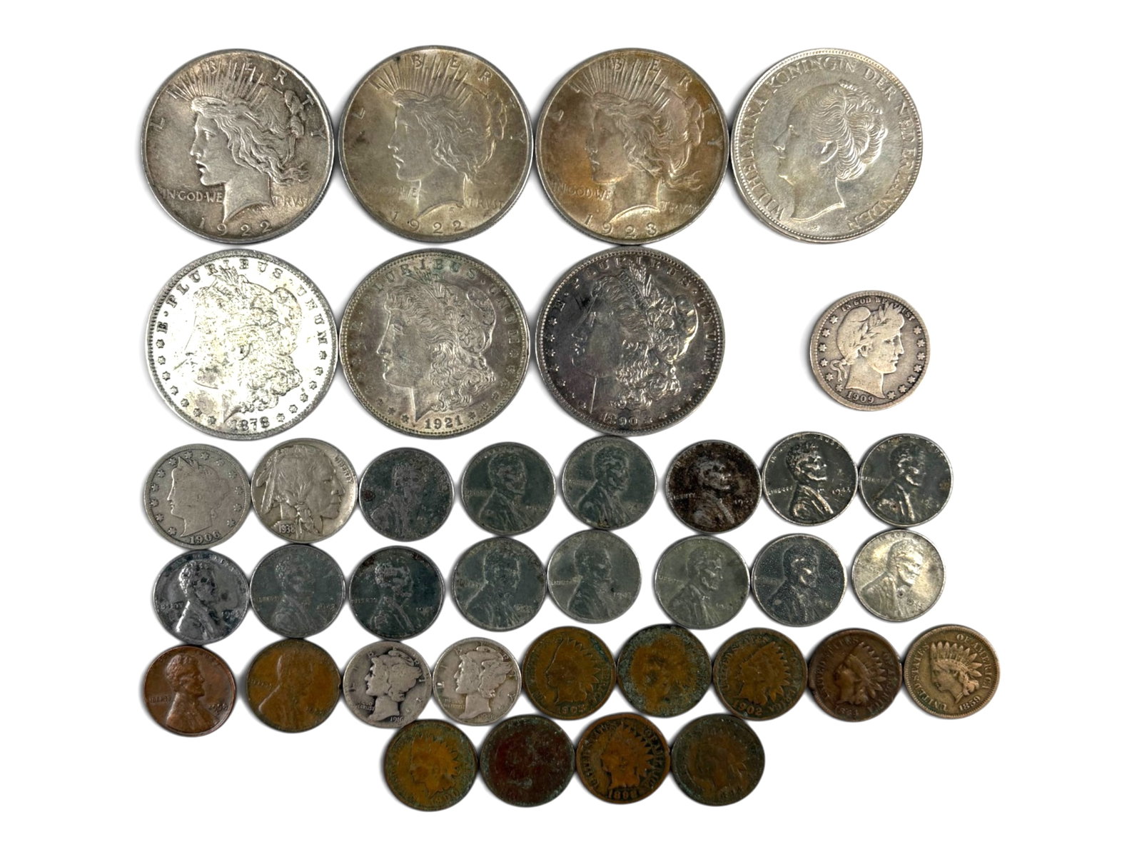 Estate Coin Collection: Estate coin collection including Morgan and Peace Dollars, Barber Quarter, Mercury Dimes, Buffalo and Libert Nickels and Indian and Wheat Cents. Also includes Curacao 2 1/2 guldan.This lot is being of