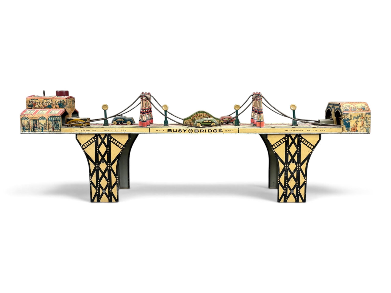 Marx Busy Bridge Wind-Up Toy: Colorful Marx Busy Bridge tin lithographed wind-up toy from the 1930s. A classic mechanical toy featuring detailed lithography and bridge action. Tested prior to cataloging and found to be in working 