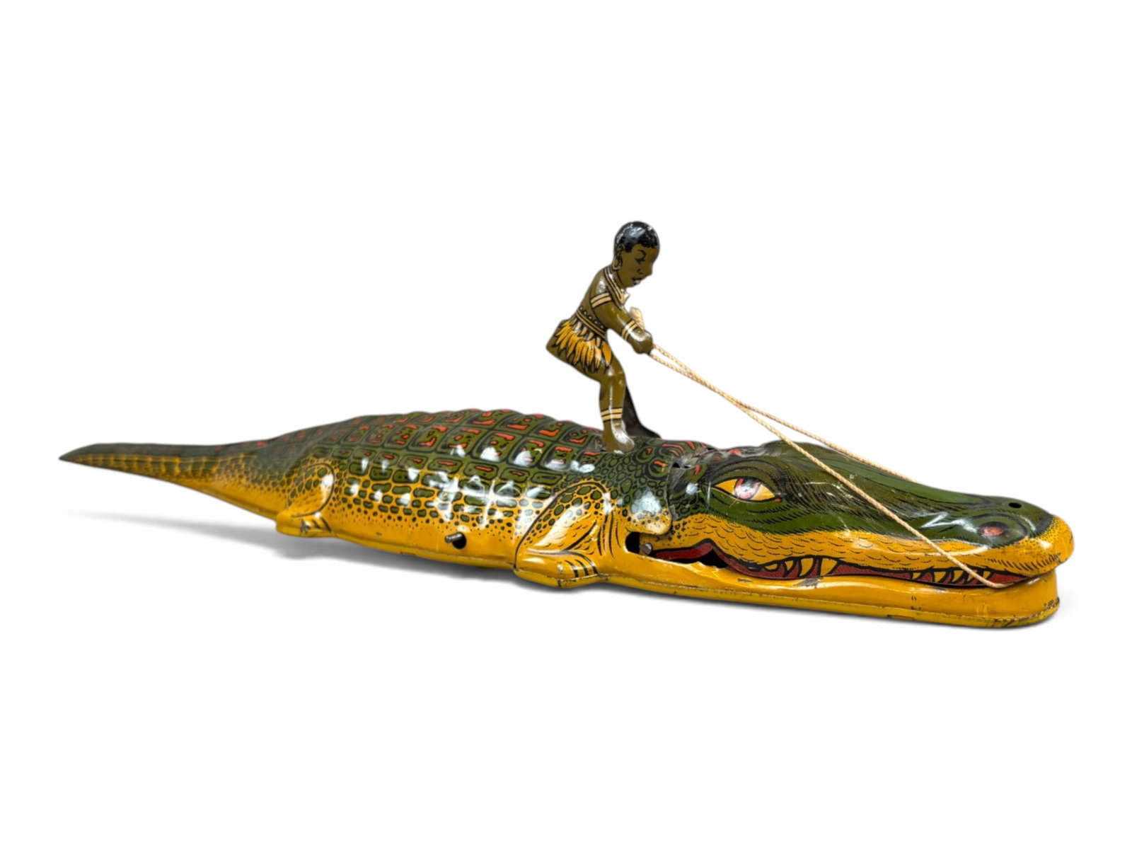 Chein Native Riding Alligator: Chein tin lithographed wind-up "Native Riding Alligator." Impressive 15-inch-long tin lithographed mechanical toy with colorful graphics. Tested prior to cataloging and found to be in perfect working