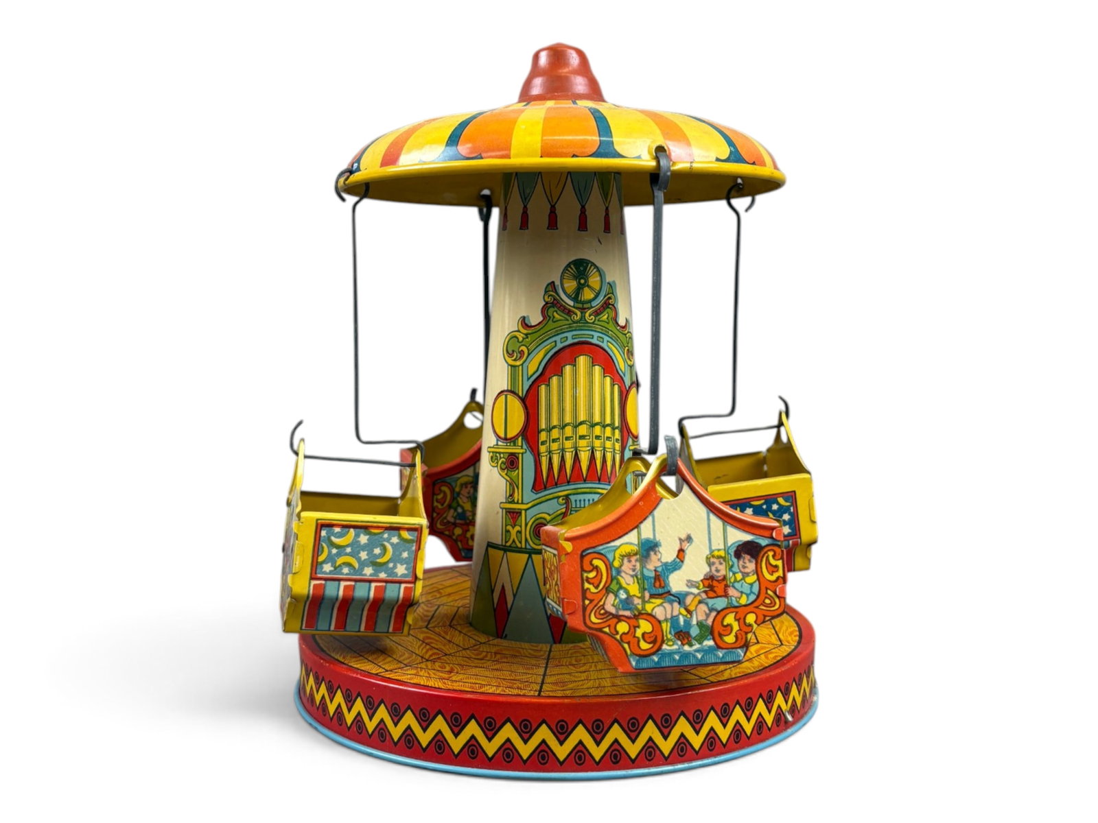 Chein Musical Carousel Wind-Up: 1930s tin lithographed wind-up musical carousel, apparently manufactured by Chein, though no maker's mark is present on the toy. Standing approximately 10 inches tall, this colorful mechanical toy was