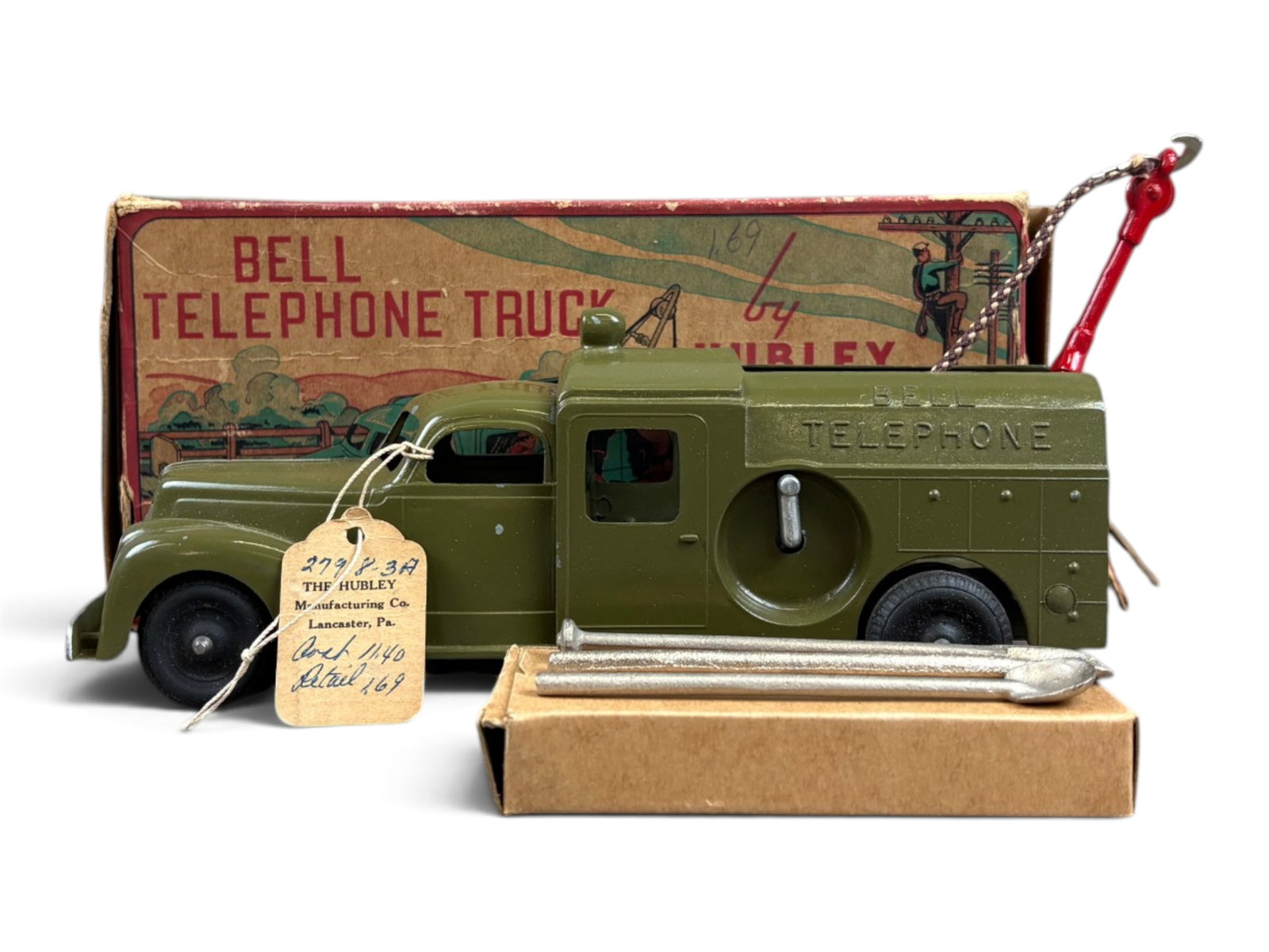 Hubley Bell Telephone Truck: Hubley Bell Telephone truck with its original box, measuring approximately 9? inches long. Truck remains in excellent condition and retains its original salesman sample label tag. Accessories appear