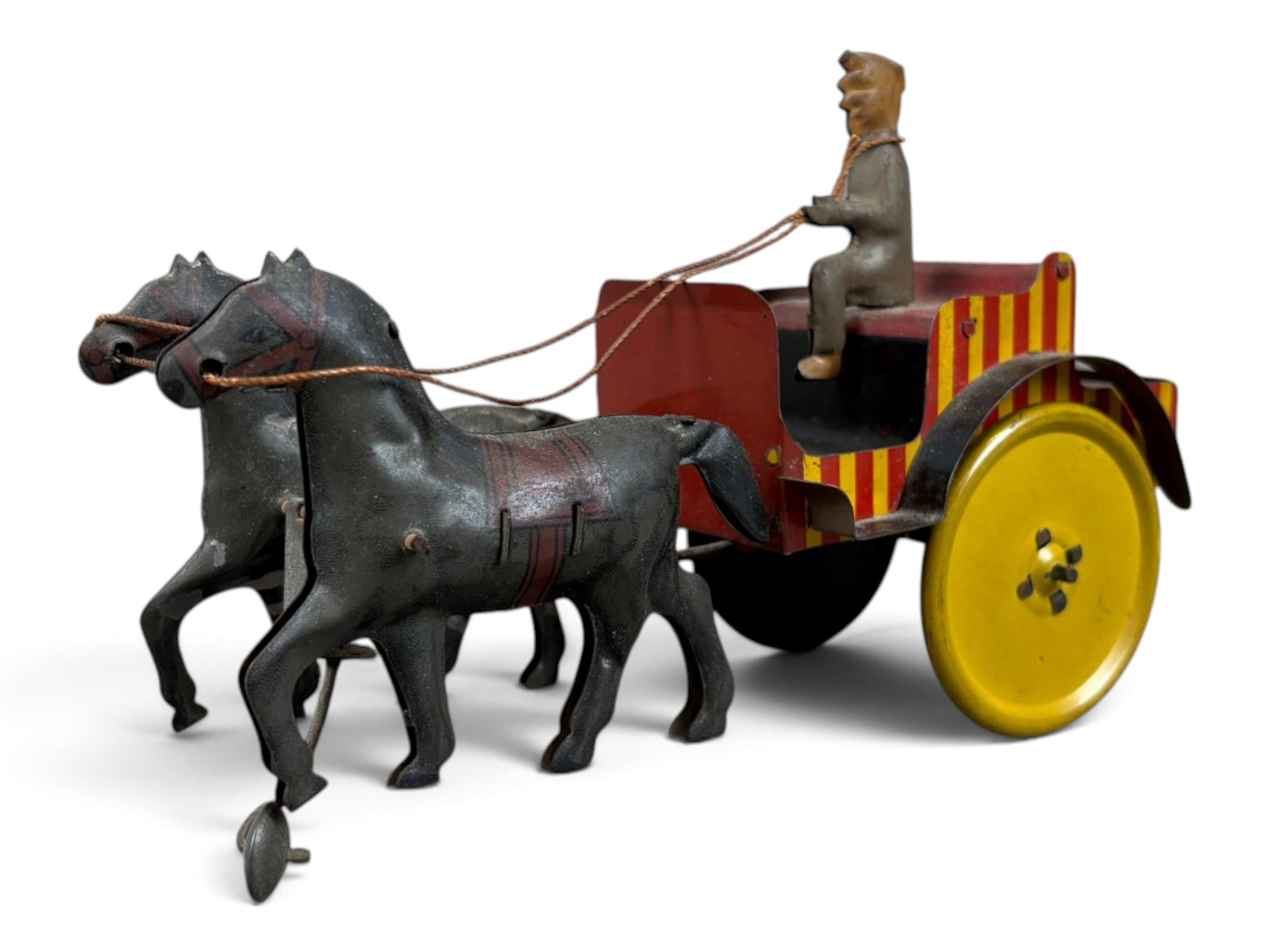 Marx Horse-Drawn Cart Wind-Up: Early Marx tin lithographed wind-up horse-drawn cart with driver, measuring approximately 7 inches long. A charming early mechanical toy with colorful lithography. Tested prior to cataloging and found