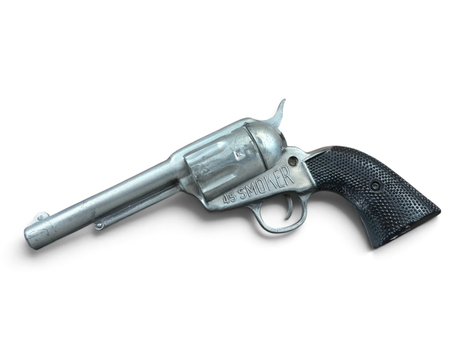 Pride of the West Smoker Pistol: Product Engineering Company .45 Caliber Smoker "Pride of the West" cap gun with its original box. This unusual toy produces a puff of powder smoke when the trigger is pulled rather than firing caps.