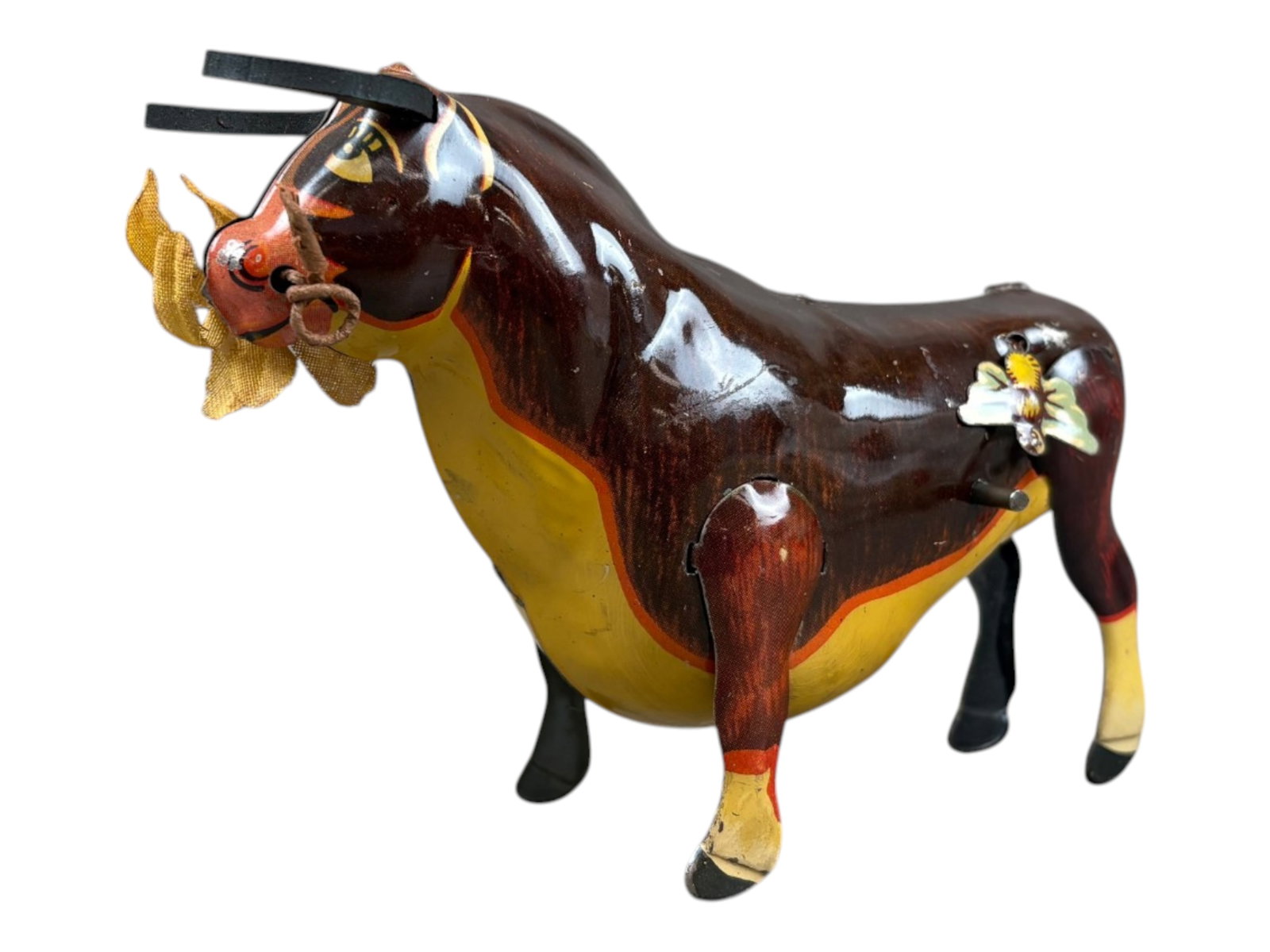 Marx Ferdinand the Bull Wind-Up: Marx 6-inch tin lithographed "Ferdinand the Bull" wind-up toy. Complete with its tin lithographed butterfly, flower in mouth, and both original rubber horns. Tested prior to cataloging and found to be