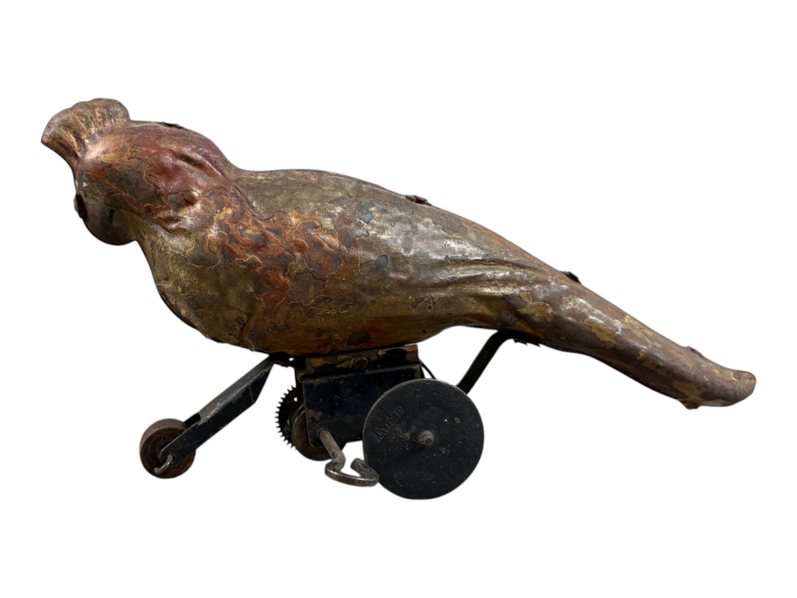 European Parrot on Wheels: Early 20th century European tin wind-up parrot on wheels. Retains approximately 50% of its original painted finish. Tested prior to cataloging and found to be in working order. An appealing early