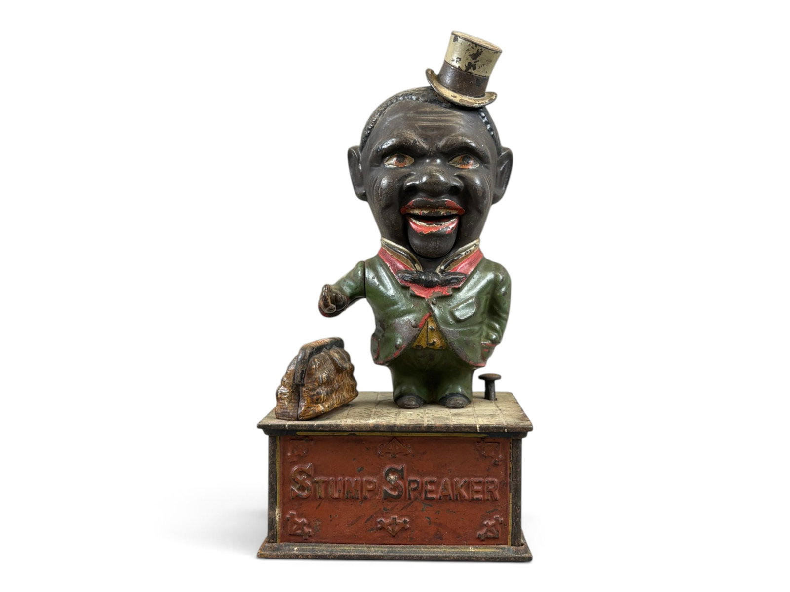 Stump Speaker Mechanical Bank: Cast iron Stump Speaker mechanical bank measuring approximately 10 inches tall. Retains approximately 60% of its original paint and was tested prior to cataloging, with the mechanical action found to