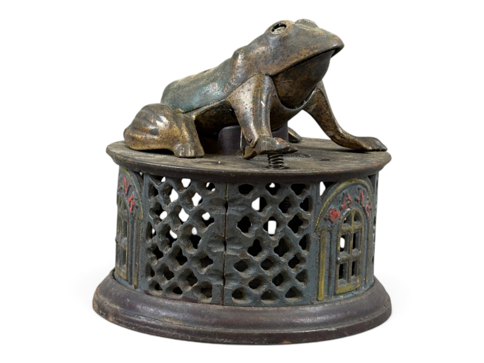 J. & E. Stevens Frog on Lattice: J. & E. Stevens "Frog on Lattice" cast iron mechanical bank. Retains a portion of its original paint and was tested prior to cataloging, with the mechanical action found to be in working order. A