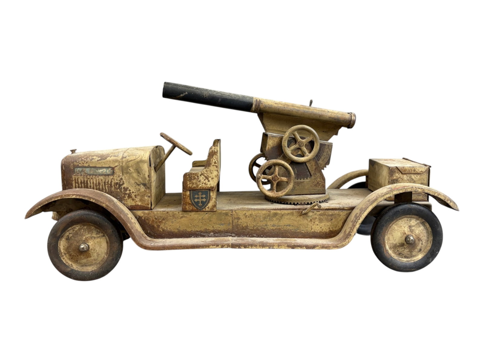 Sonny Pressed Steel Anti Aircraft Cannon Truck: Approx. 23.5" long. Steel disc wheels with open cab, and cannon with multiple hand wheel gears. Retains an aged tan/khaki paint finish with remnants of original decals. Shows wear throughout with