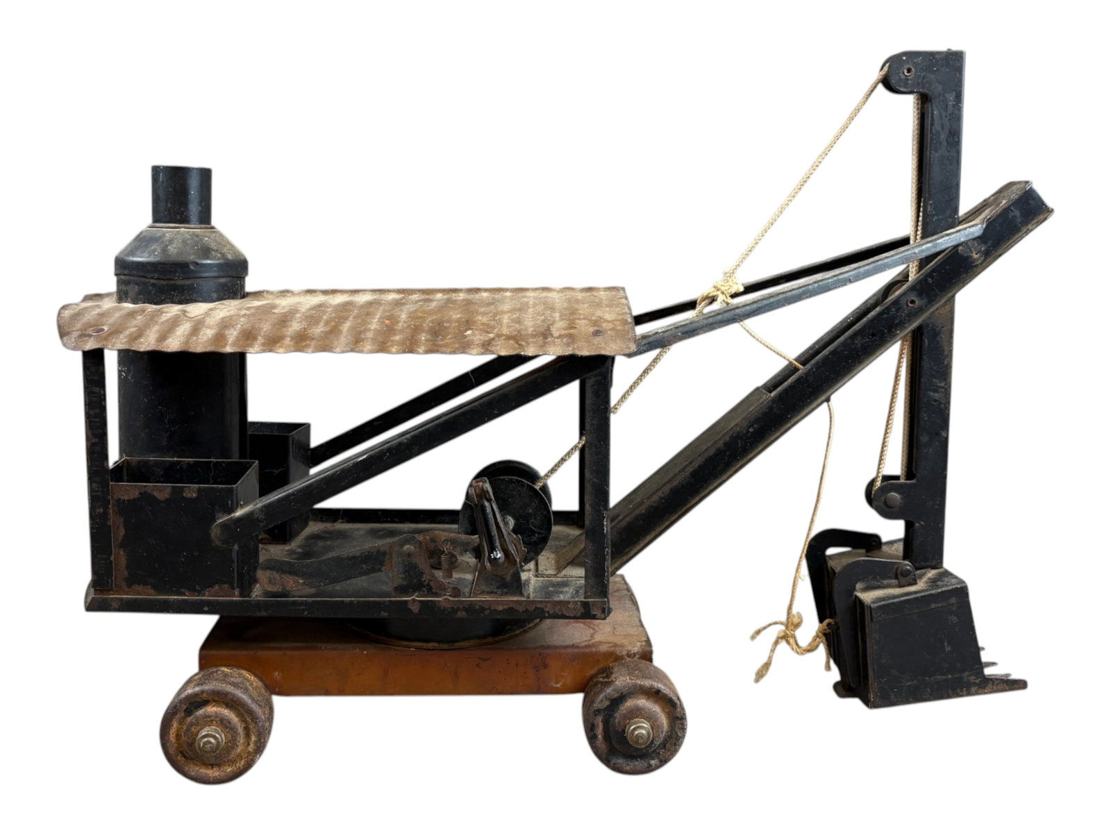 Keystone Pressed Steel Steam Shovel Toy: Keystone pressed steel steam shovel toy. Large construction toy features a black painted revolving shovel body mounted on a brown four-wheel base, corrugated metal roof, simulated boiler and