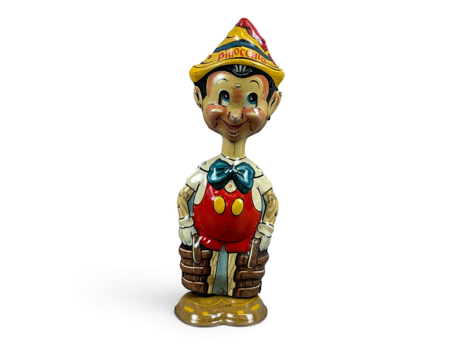 Marx Pinocchio Walker Wind-Up: Marx tin lithographed wind-up Pinocchio walker measuring approximately 8? inches tall. An extremely clean example with bright, colorful lithography. Tested prior to cataloging and found to be in worki