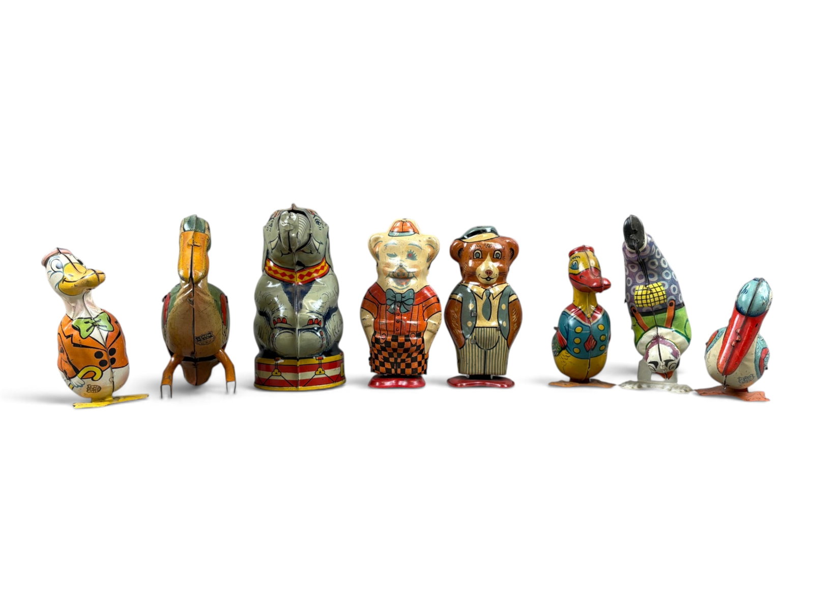 (8) Chein Tin Litho Toys: Lot of eight Chein tin lithographed toys. Includes seven wind-up toys, four of which were tested and found to be in perfect working order. The remaining three appear to be overwound and likely