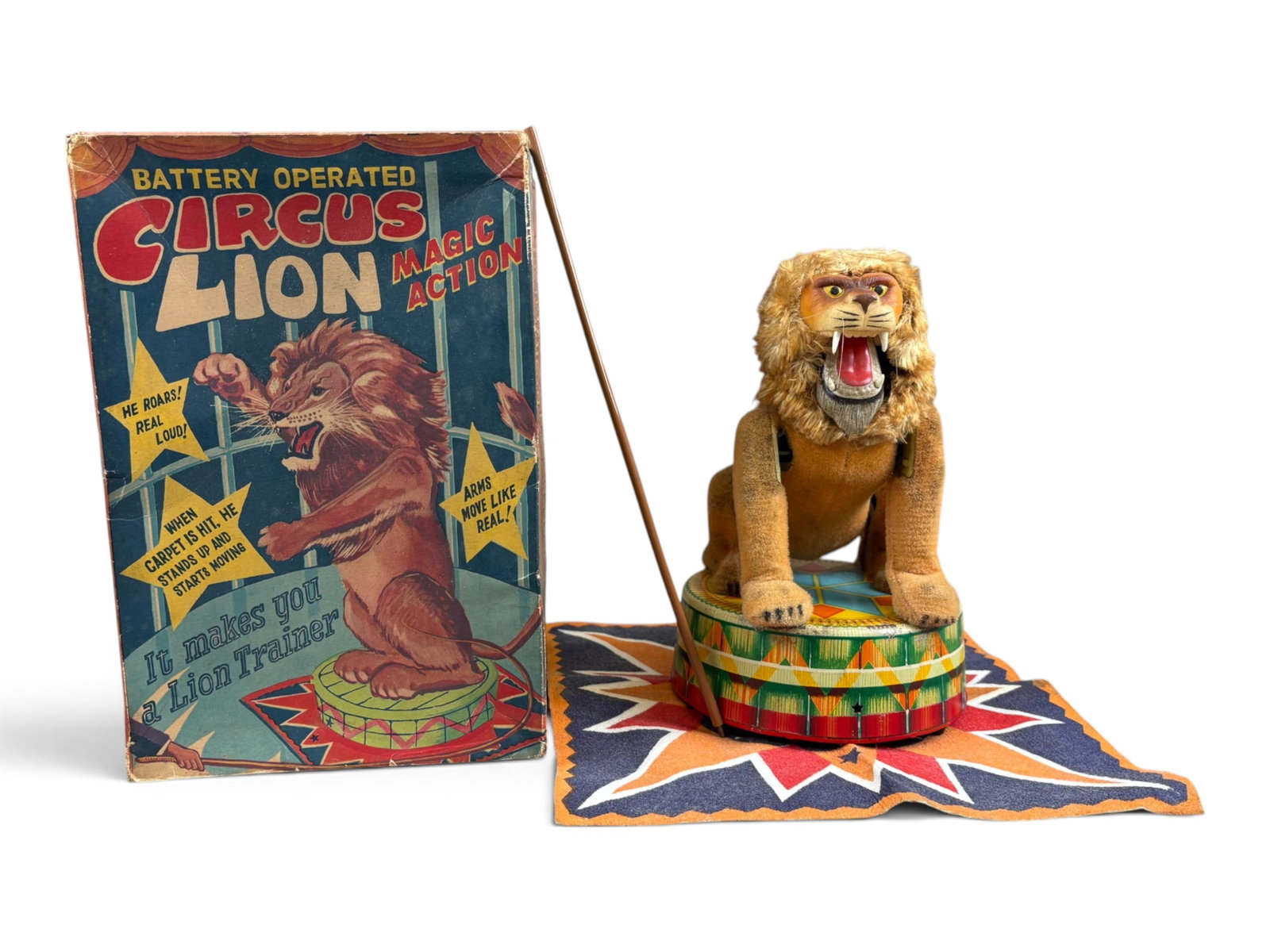 Japanese Circus Lion Toy: Japanese battery-operated tin lithographed "Circus Lion with Magic Action" with its original box featuring fabulous graphics. Includes the original mat and training rod. Tested prior to cataloging