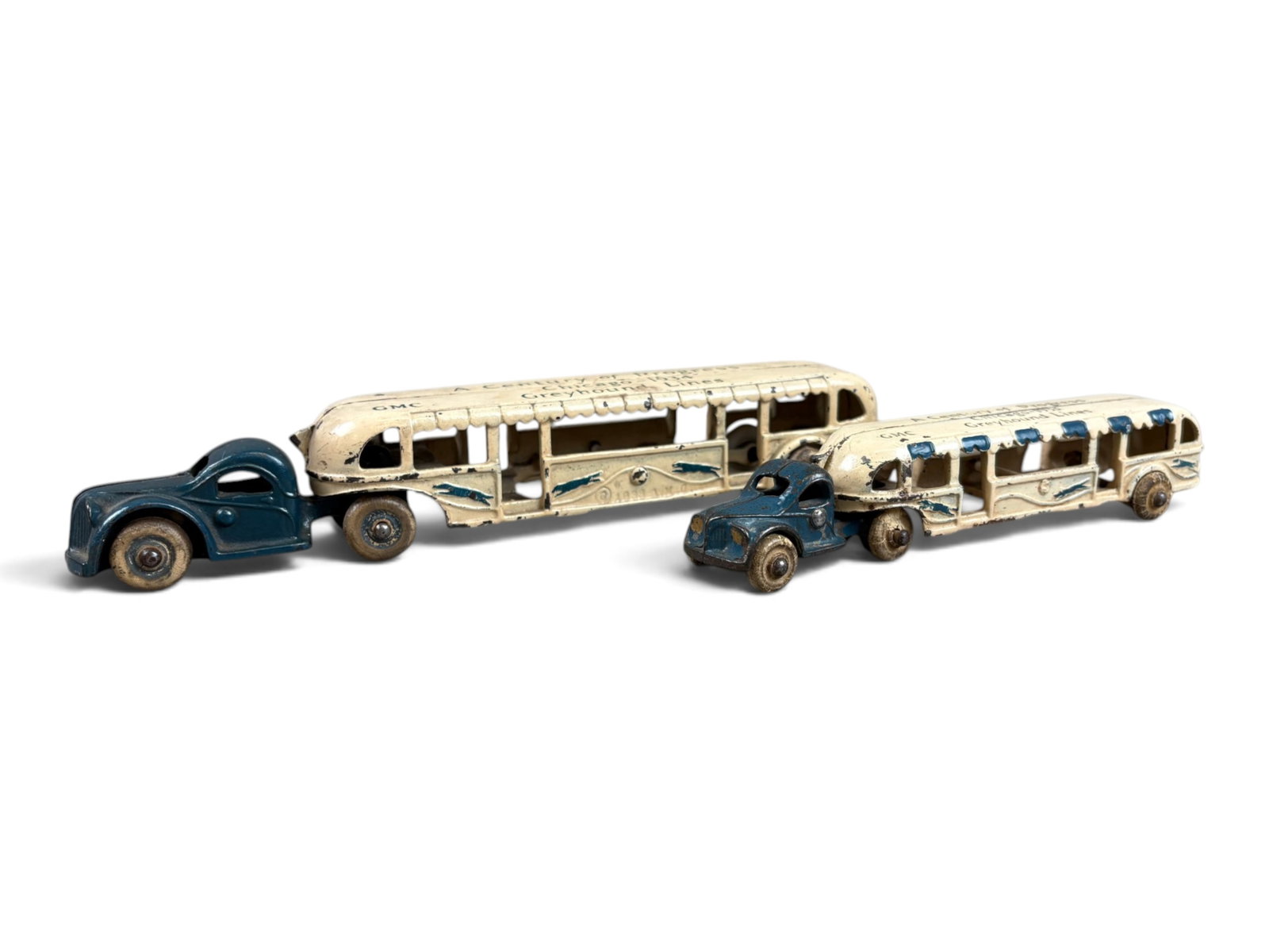 (2) Arcade Century of Progress Buses: Lot of two Arcade cast iron A Century of Progress buses. Includes a 7?-inch version with all original wheels, retaining a good portion to most of its original paint, together with a 10?-inch