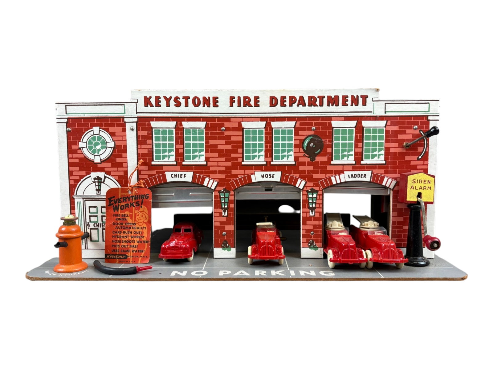 Nice Large Keystone Fire Department: Paper litho on wood with masonite, 18X10X8?. It is very complete with original Keystone operating tag. The siren moves, but very dry, so needs lubrication. Includes 2 plastic ladder trucks, pumper