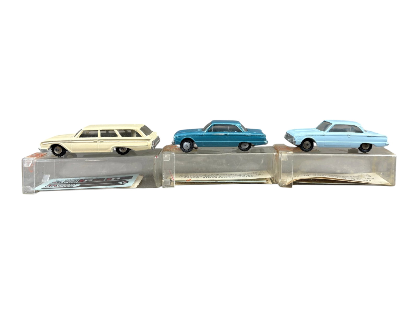 3 LN Boxed 1961 Hubley Real Toy Vehicles: Includes 425 Ford Falcon, lt blue; 427 Ford Country Squire Wagon, both with club paper and decals sheet; 425 Ford Falcon, teal blue with club sheet, all show light handling with clear plastic boxes.