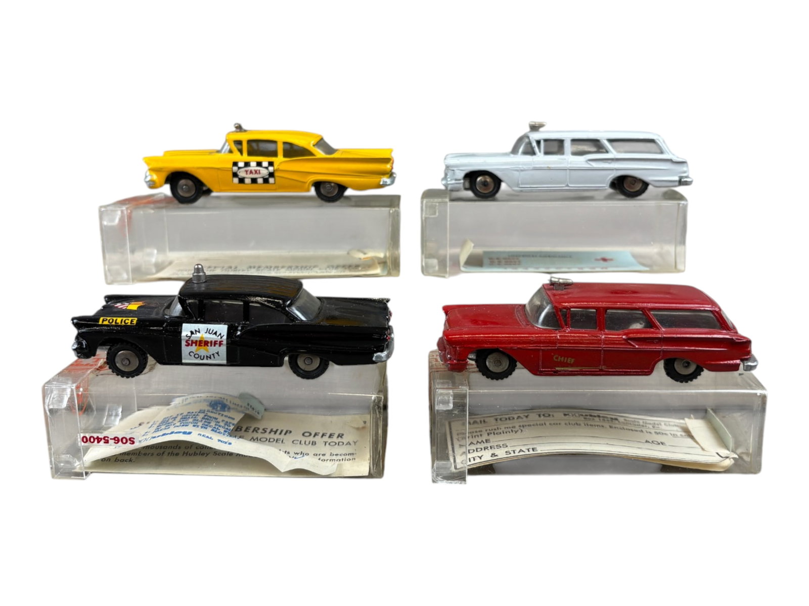 4 Nice Boxed 1961 Hubley Real Toy Vehicles: Includes a 555 Ford Fairlane County Sheriff Car; 554 1958 Ford Fairlane Taxi, both with partial decal sheets and club paper; 552 1958 Chevy Yeoman Ambulance with partial decal sheet; 553 1958 Chevy