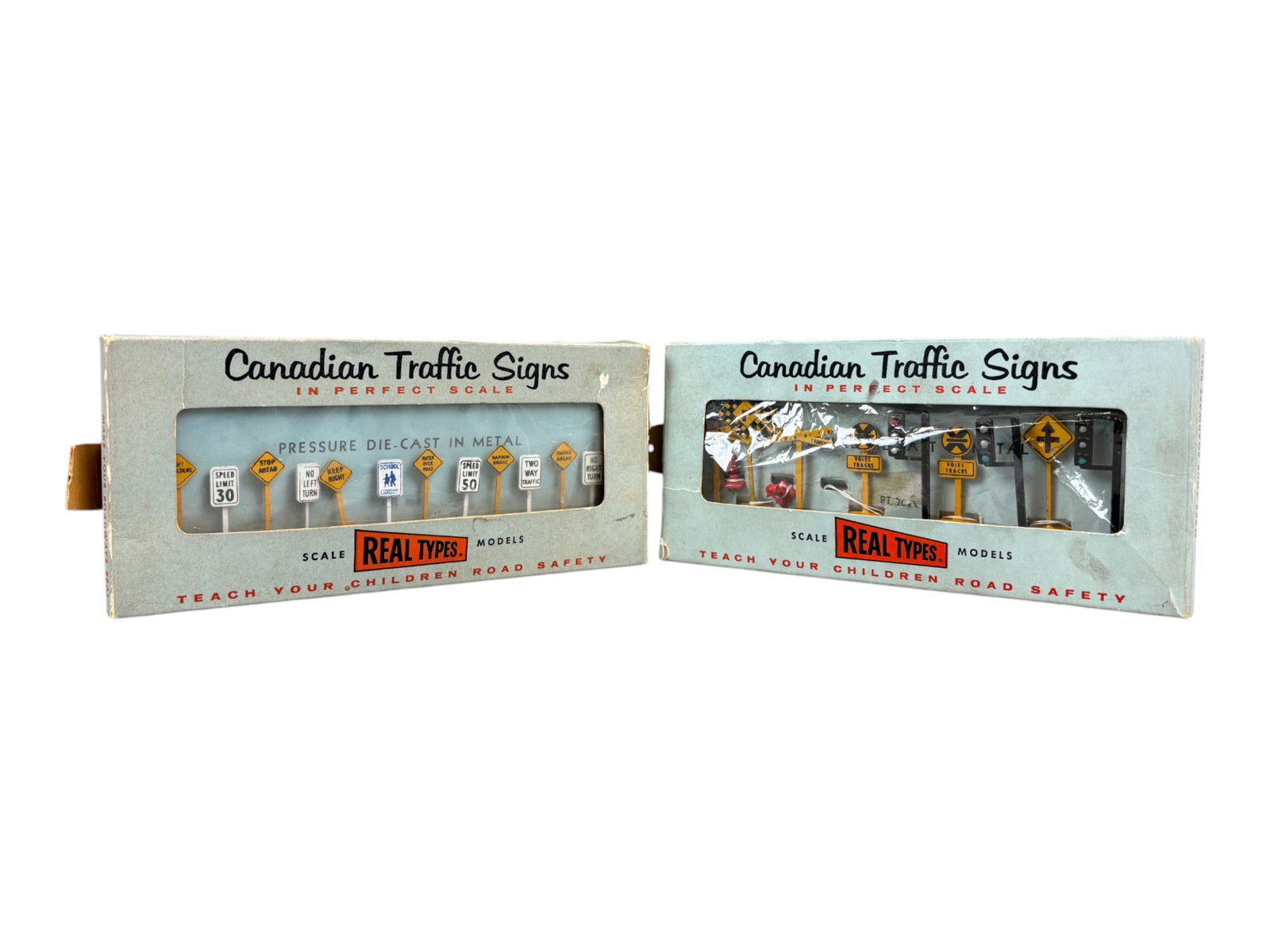 2 Scarce Boxed Hubley Real Toy Canadian Sign Sets: Hubley manufactured a few Real Toys in Canada and vehicles are thus marked. Includes Rt 70 Traffic Signs, Rt 70A RR, Stop Light Hydrants set. They appear like new in cellophane window display boxes.
