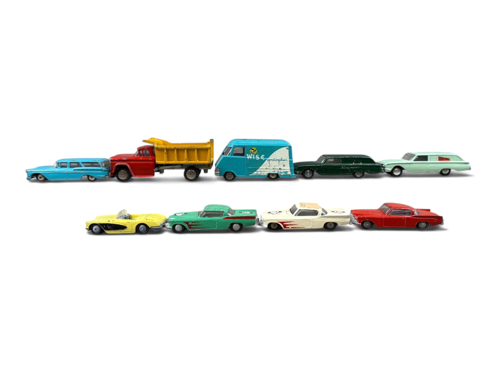 9 Hubley Real Toy Vehicles: Assorted USA examples, with some unusual colors. All show wear, dump truck is missing is tail gate. Sold AS-IS. Examine photos closely. Shipping: Weiss Auctions offers full-service, in-house shipping
