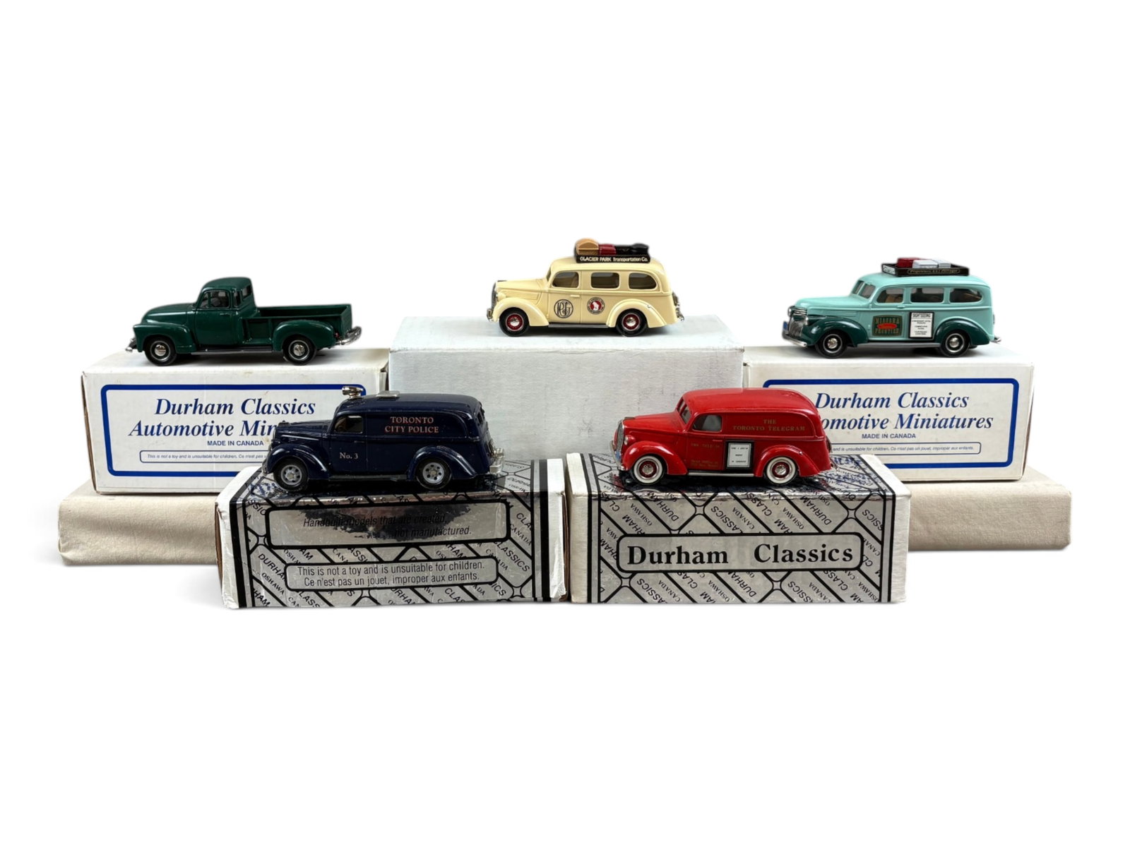 5 Durham Models: Includes a 53 Chevy Pick-up; DC23B Ford Bus; 41 Chevy Panel Van; Ford Toronto Telegram Van; 23 Chevy Police. Rest appear like new with foam and boxes. Shipping: Weiss Auctions offers full-service,