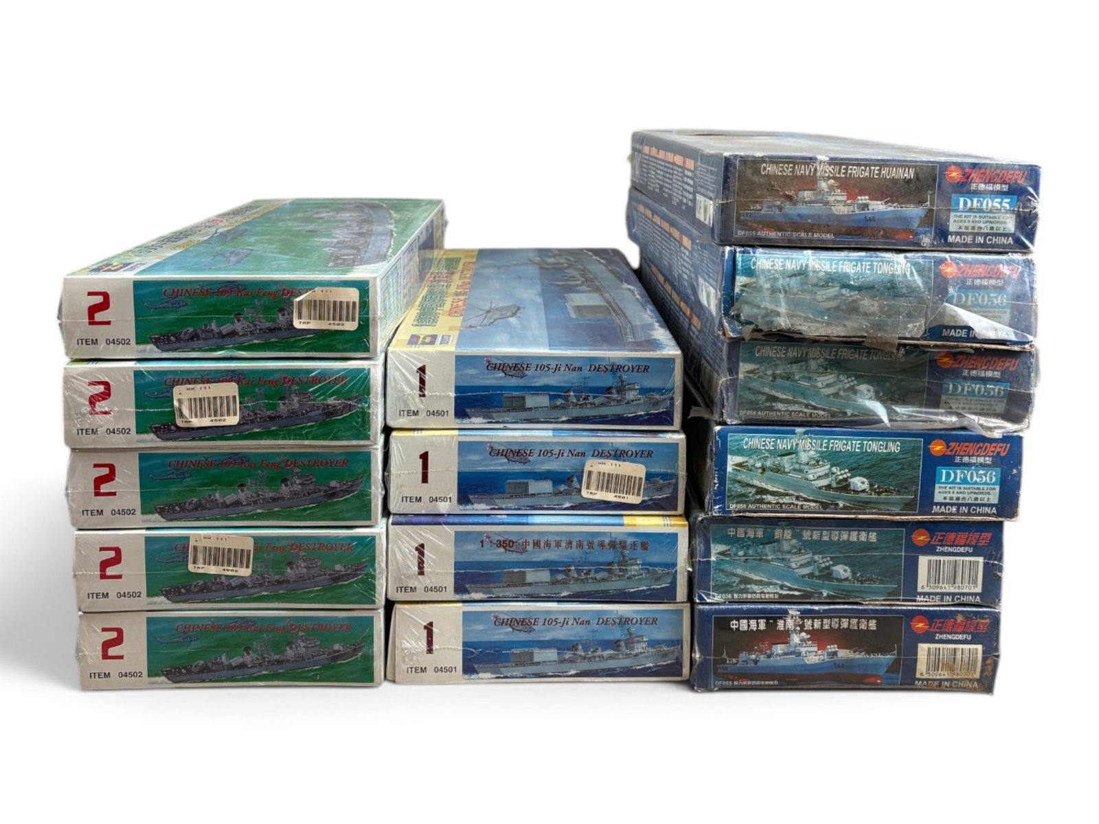 15 Military Ship Model Kits: Includes 9 Trumpeter kits- Four- 4501, Five-4502; Zhengdsfu -Four DF056, two DF055. All are unbuilt, new in cellophane wrapped boxes, some wrapping worn. Shipping: Weiss Auctions offers full-service,