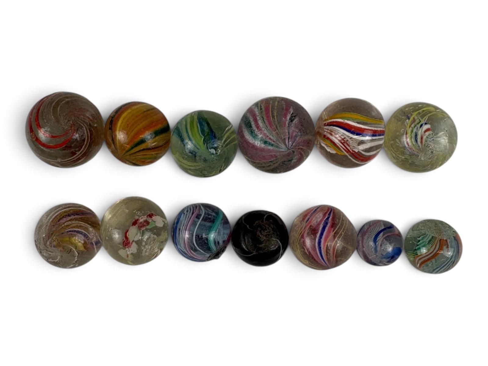 13 Assorted European Hand Made Marbles: Circa 1900. Largest is 3/4 inch, smallest is 7/16th. Some interesting styles and colors, 1 even has a Lutz swirl. They vary in condition from VG to EX. Examine photos closely. Shipping: Weiss