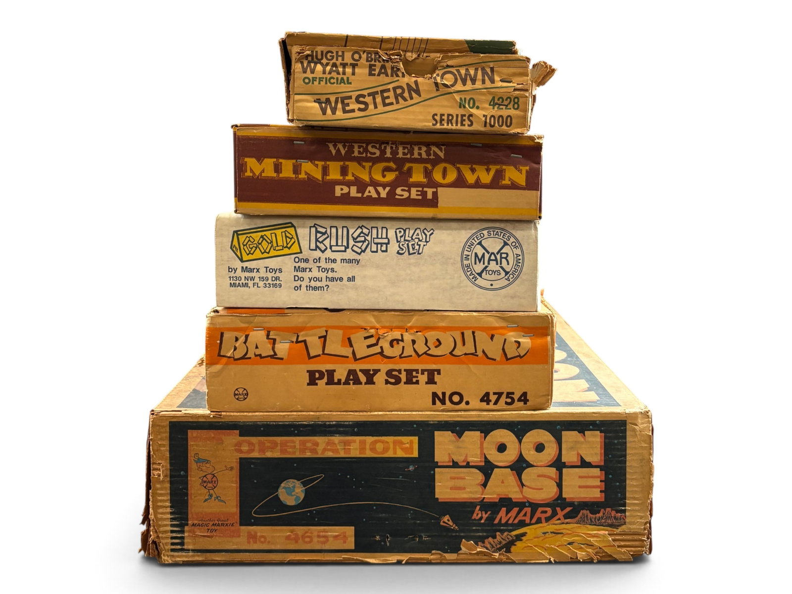 Large Lot Marx Western Play Set Parts, Plus: Includes a Moon Base 4654 Set Box filled with tin western town buildings and figures; Battleground 4754 Set box filled with western play set parts; Worn Wyatt Earp Dodge City 4228 set box filled with