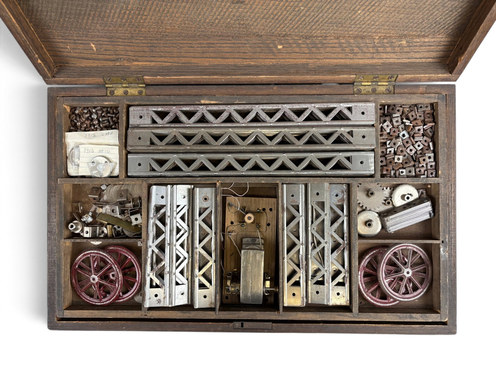 Circa 1913 A.C. Gilbert No. 8 Erector Set: Early A.C. Gilbert No. 8 Erector Set, circa 1913, housed in its original three-tier wooden storage case with fitted compartments. The set includes a large assortment of early nickel-finished girders, 